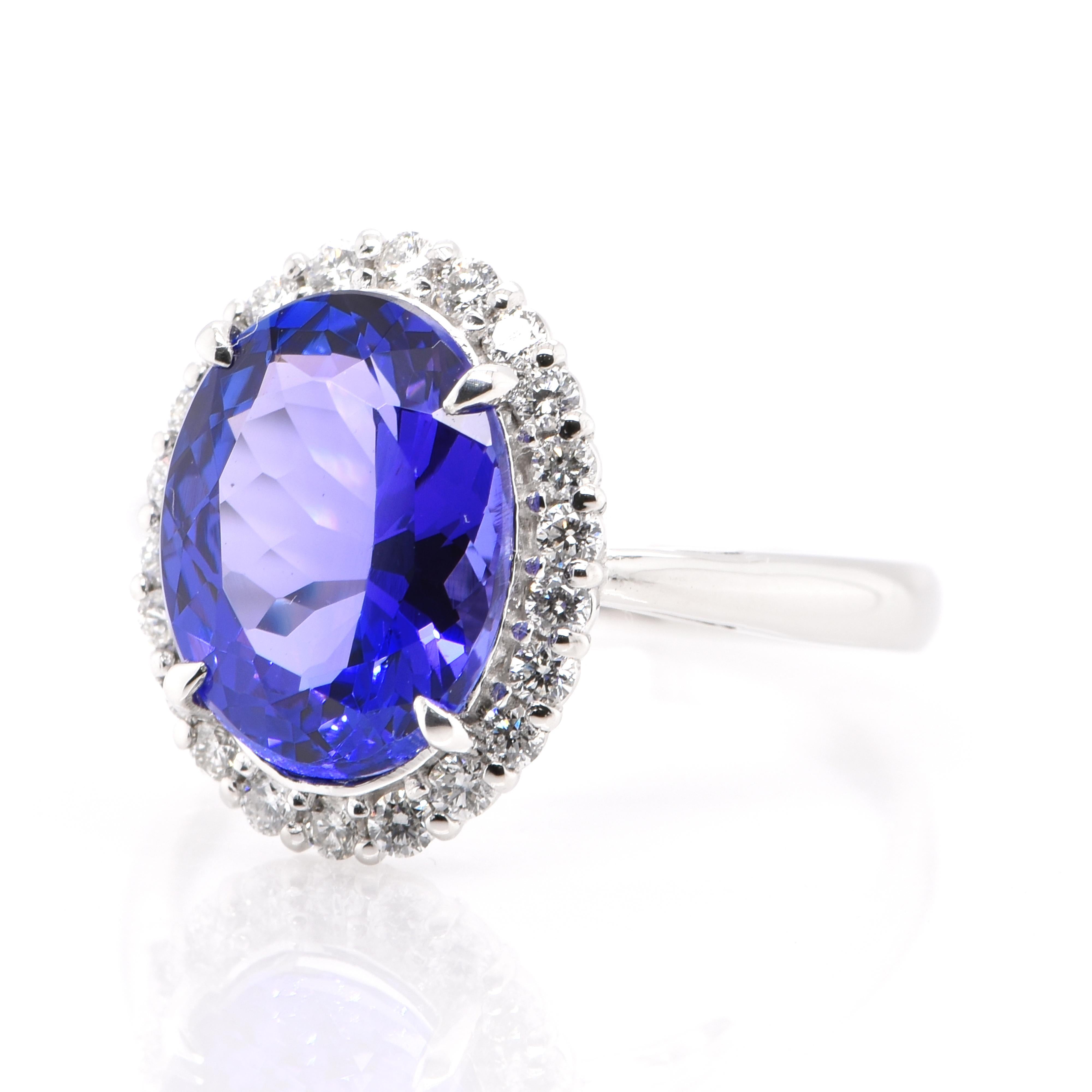 A beautiful Halo Ring featuring a 3.52 Carat, Natural, Tanzanite and 0.32 Carats of Diamond Accents set in Platinum. Tanzanite's name was given by Tiffany and Co after its only known source: Tanzania. Tanzanite displays beautiful pleochroic colors