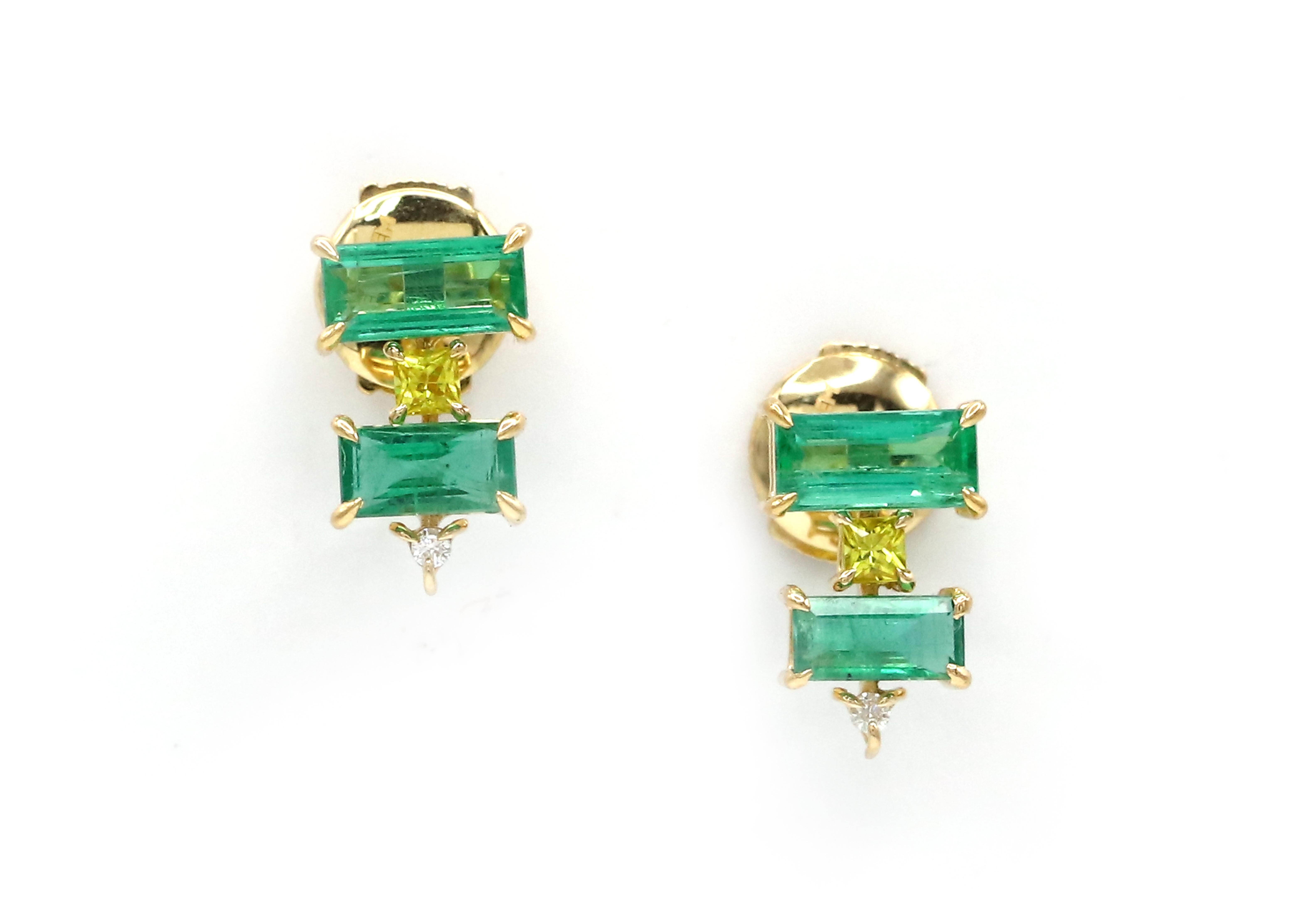 These earrings is where the iconic Art Deco meets contemporary jewelry. These elegant 18 K yellow gold earrings feature gorgeous rectangular clear bright emeralds, princess cut peridots and white diamonds. The Art Deco elements of the jewelry are