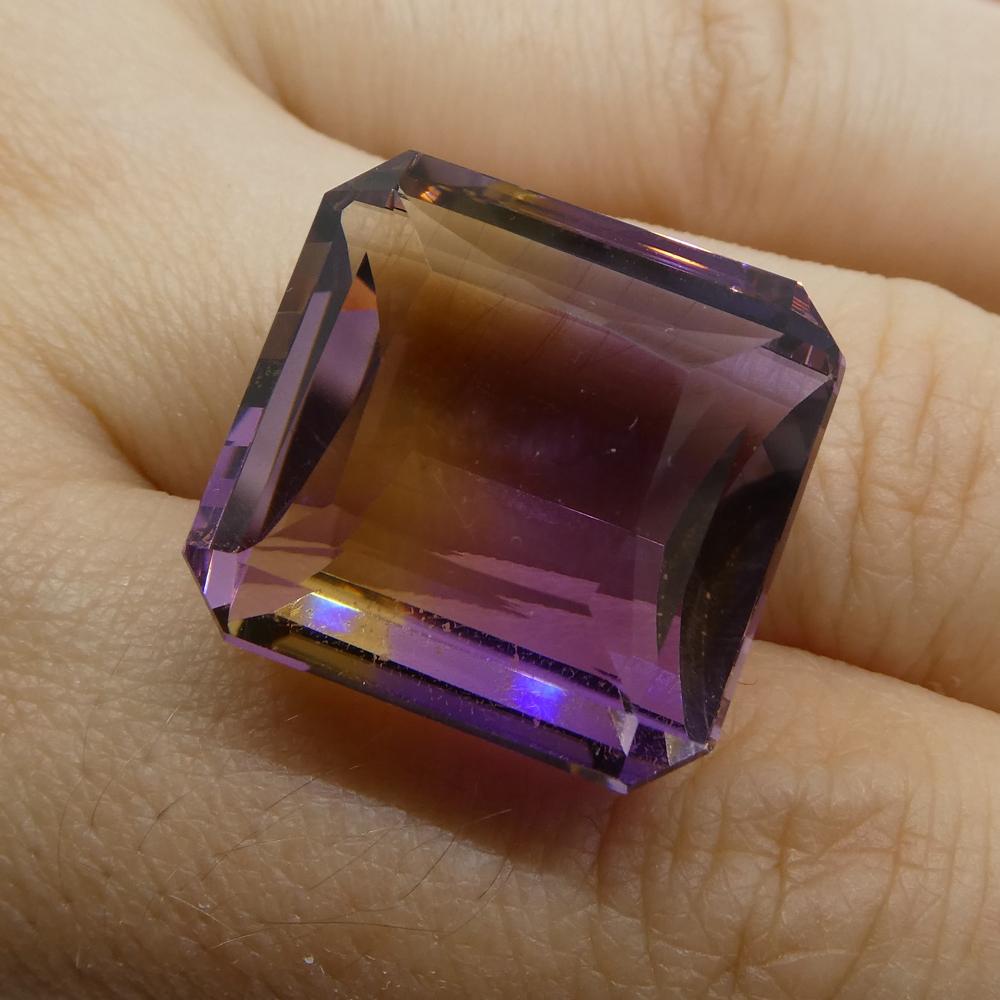 Description:

Gem Type: Ametrine
Number of Stones: 1
Weight: 35.21 cts
Measurements: 19.30x19x11.40 mm
Shape: Square
Cutting Style Crown: Step Cut
Cutting Style Pavilion: Step Cut
Transparency: Transparent
Clarity: Very Slightly Included: Eye Clean