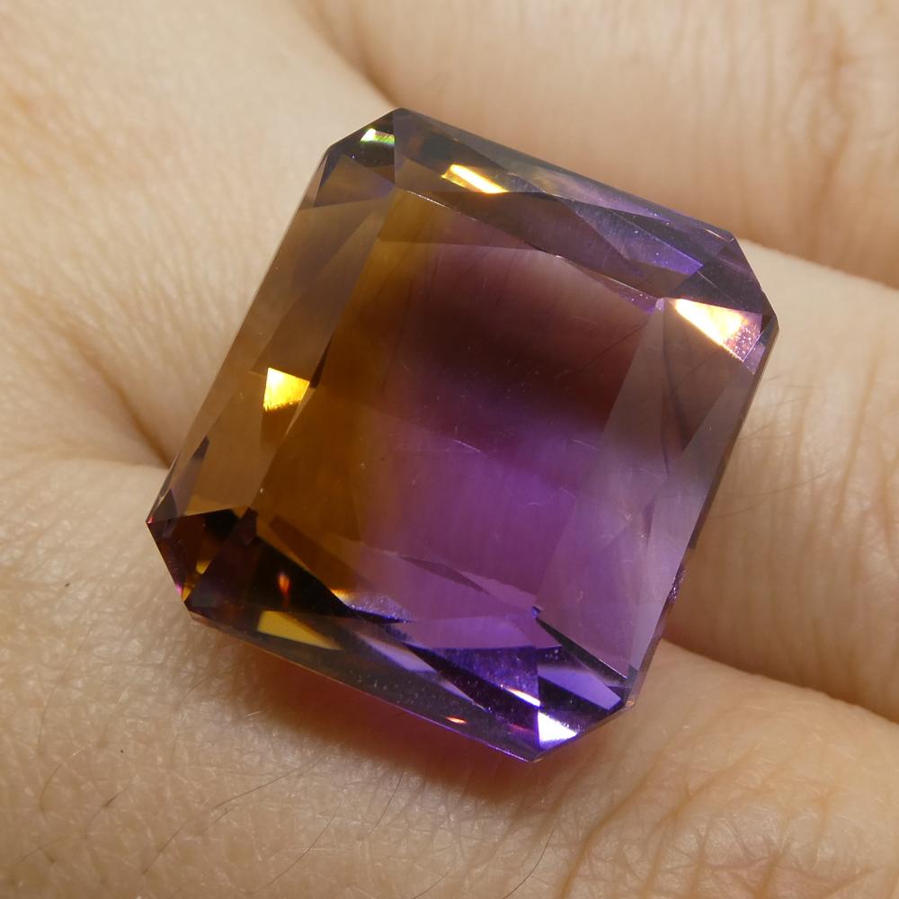 Description:

Gem Type: Ametrine
Number of Stones: 1
Weight: 35.21 cts
Measurements: 18.50x17.70x13 mm
Shape: Square
Cutting Style Crown: Step Cut
Cutting Style Pavilion: Mixed Cut
Transparency: Transparent
Clarity: Very Slightly Included: Eye Clean