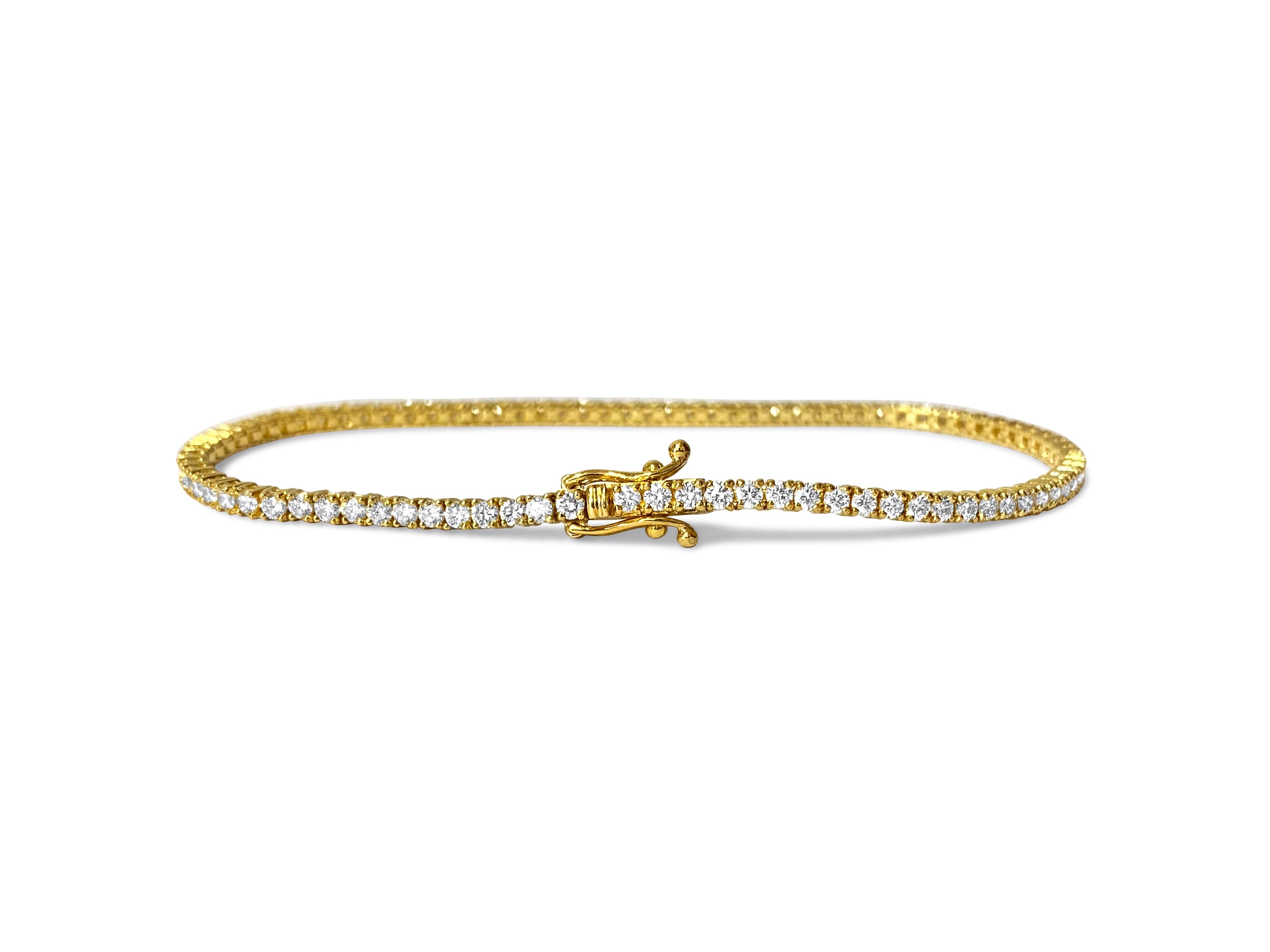 Created in stunning 14k yellow gold, this top-of-the-line diamond tennis bracelet showcases a remarkable 3.52 carats of round brilliant cut diamonds, each boasting VVS-VS clarity and H color for exceptional brilliance and radiance. Set securely in