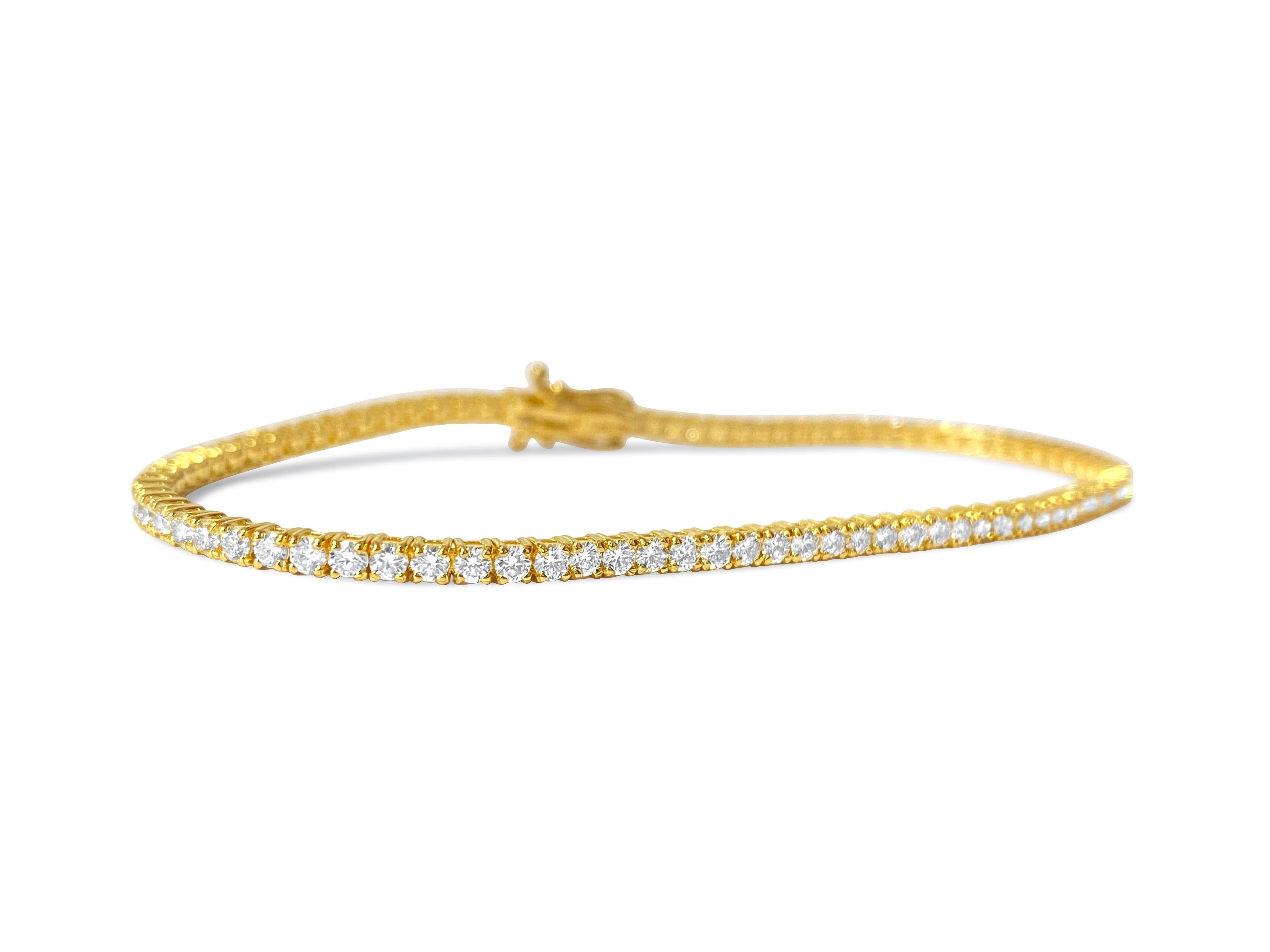 Created in stunning 14k yellow gold, this top-of-the-line diamond tennis bracelet showcases a remarkable 3.52 carats of round brilliant cut diamonds, each boasting VVS-VS clarity and H color for exceptional brilliance and radiance. Set securely in