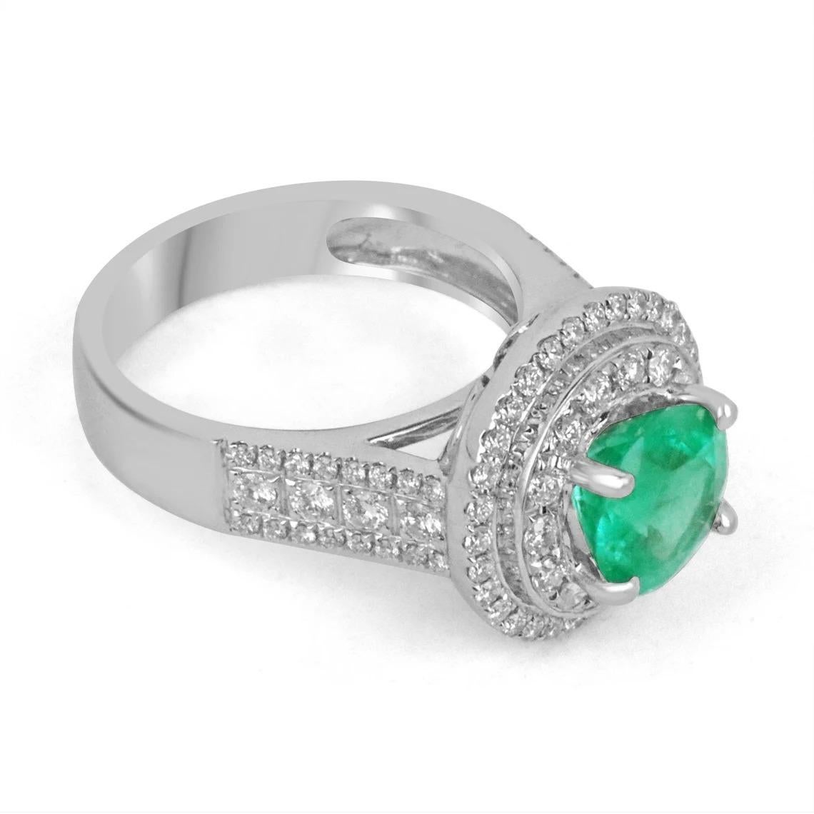 This is a very rare, round Colombian emerald and diamond engagement/right-hand ring. Color and brilliance can best describe this rare Colombian emerald ring. The luminous, bluish-green, round emerald has amazing qualities that make it exclusive. The