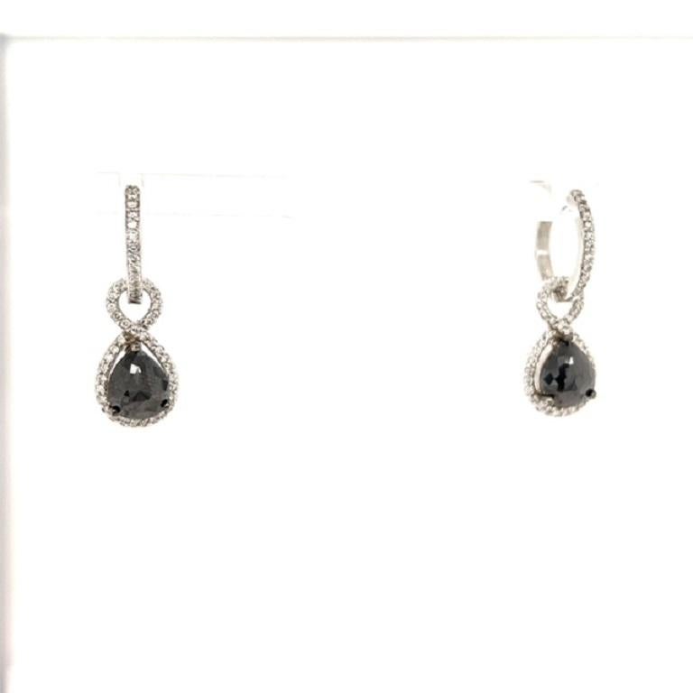 

These earrings have Black Pear Cut Diamonds that weigh 2.86 Carats and Round Cut White Diamonds that weigh 0.68 Carats. The total carat weight of the earrings are 3.53 Carats. The length of the earrings are approximately 1 inch. 

They are curated