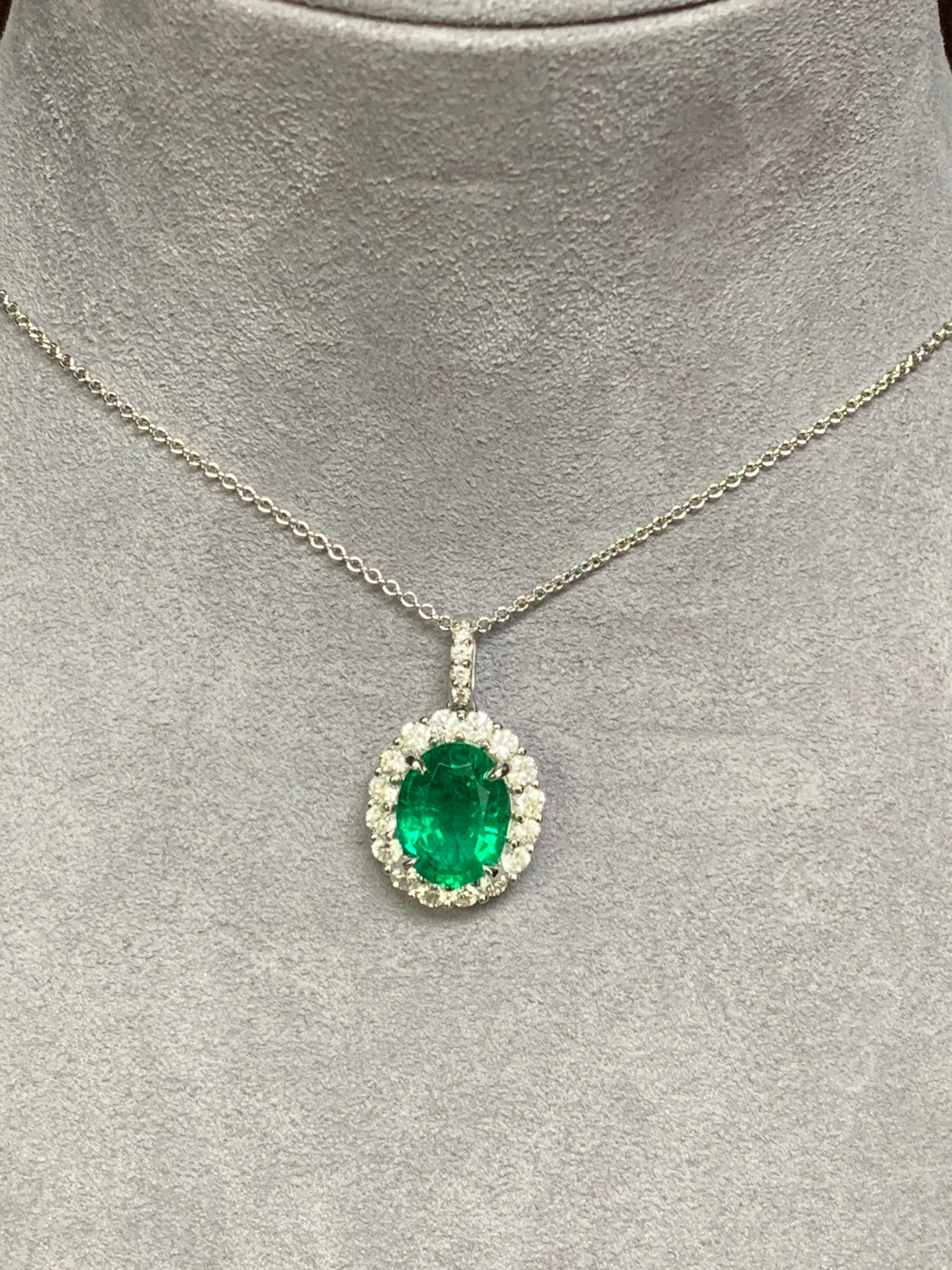 Auction - GIA Certified 3.53 Carat Oval Emerald and Diamond Pendant In New Condition For Sale In New York, NY