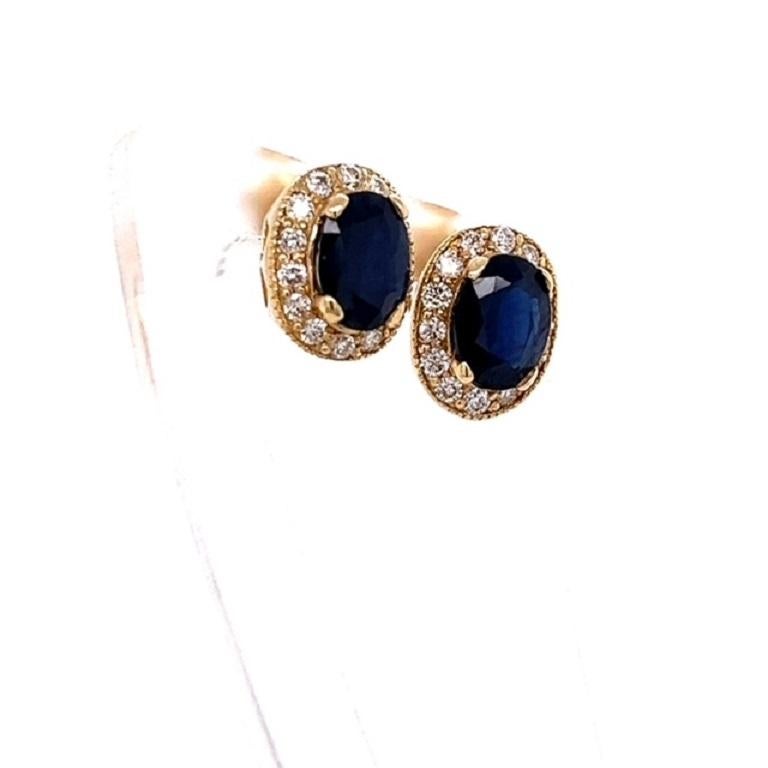 These beautiful earrings have 2 Natural Oval Cut Sapphires that weigh 3.00 carats and have 28 Round Cut Diamonds that weigh 0.53 Carats. The total carat weight of the earrings are 3.53 carats. 

They are set in 14 Karat Yellow Gold and weigh