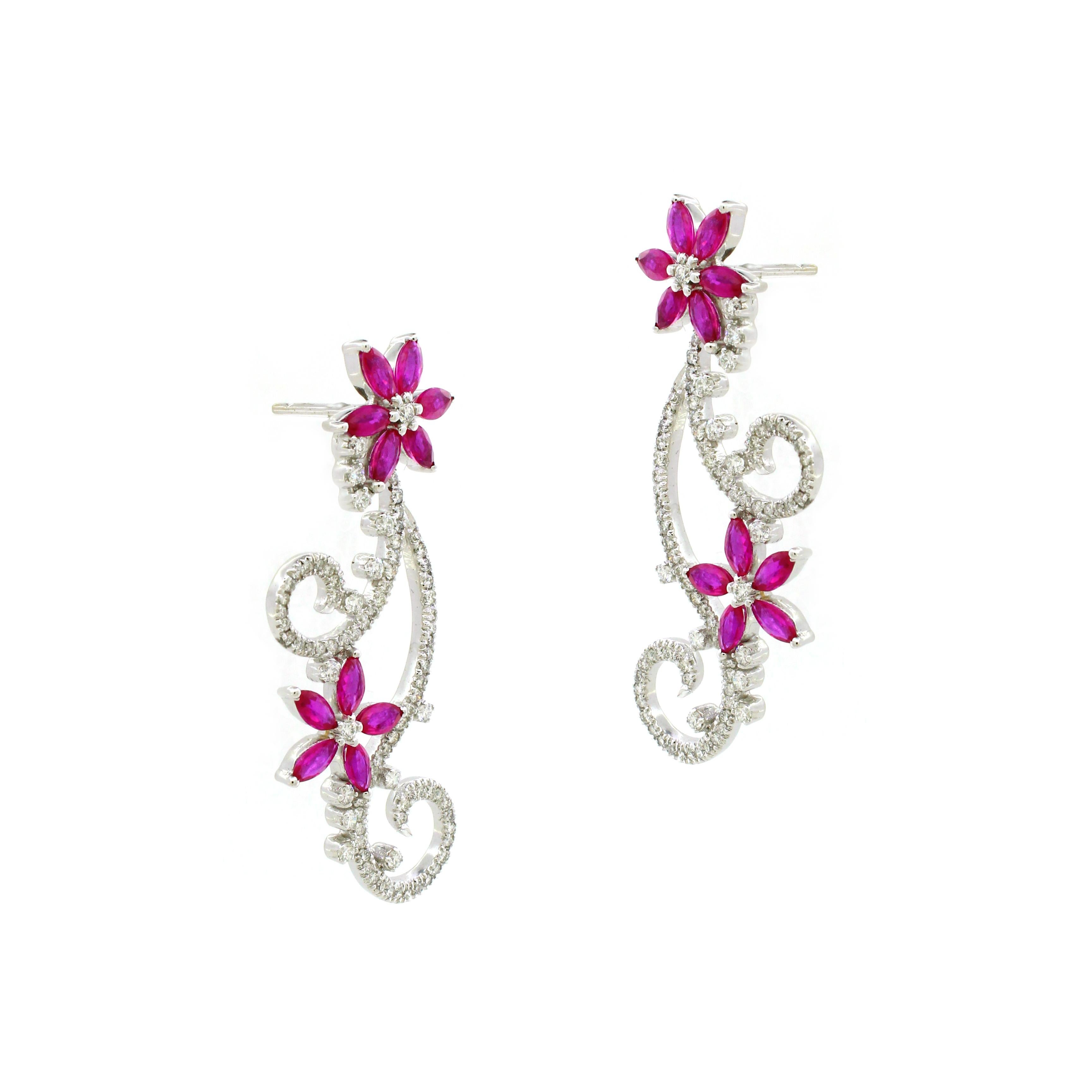 
Introducing our exquisite Flower-Inspired Drop Earrings, a stunning tribute to nature's beauty. Inspired by the delicate petals of a blooming flower, these earrings boast a captivating amalgamation of rubies and diamonds that make them truly stand