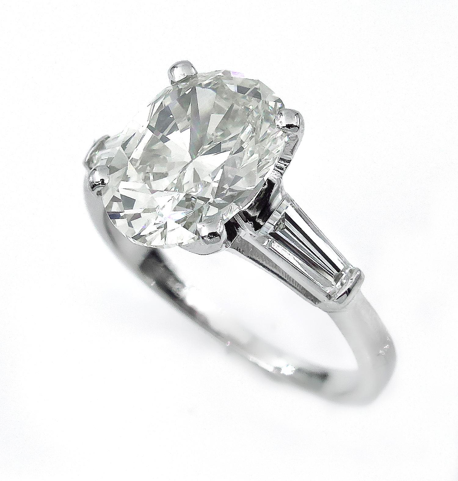 3.53 Carat Classic Oval Cut Diamond EGL USA Platinum Ring with Baguettes In Good Condition In New York, NY
