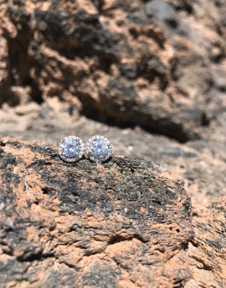 Designed to be worn from day to dinner, each earring showcases a 1.50ct cubic zirconia stone set within a 0.25ct halo of sparkling brilliance.

Composed of 925 sterling silver with a 14kt yellow gold finish.

Whether you're looking for a classic