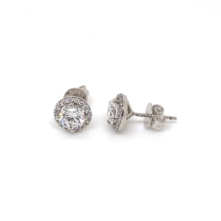 Designed to be worn from day to dinner, this beautiful pair of halo studs feature a row of excellent quality round brilliant cut cubic zirconia set delicately to allow the 1.20ct centre Cubic to shine.

Composed of 925 sterling silver with a rhodium