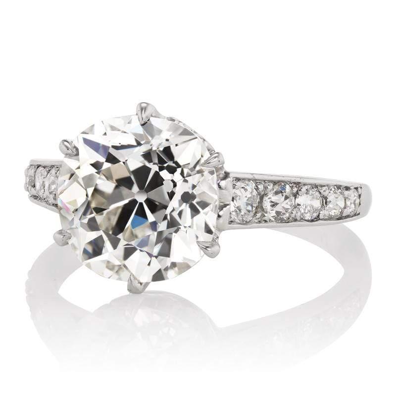 This ring is an authentic vintage piece from the Art Deco era signed Tiffany & Co. The ring centers a GIA-certified 3.54-carat old mine cut diamond of J color, VS1 clarity. The stone is set in a 6-prong platinum setting with 5 old European cut