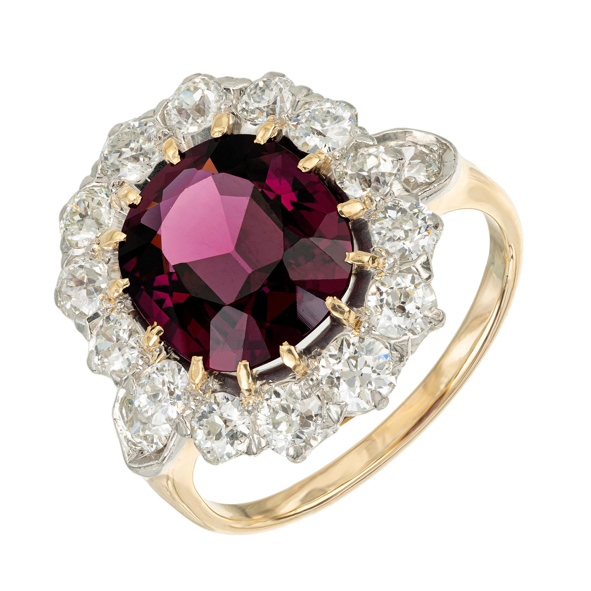 Early 1900's Radiant and elegant, the 3.54 carat oval rhodolite garnet and diamond halo engagement ring is a stunning masterpiece that captures the essence of sophistication and beauty. The center piece of this piece is a stunning 3.54ct oval garnet