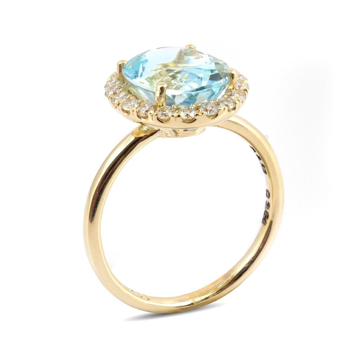 This ring is the epitome of elegance, featuring a 3.54 carat Aquamarine with its soothing and beautiful cool blue tones. Set in 14K yellow gold, the gemstone's soft colors come to life, and the design places all the emphasis on its exquisite beauty.