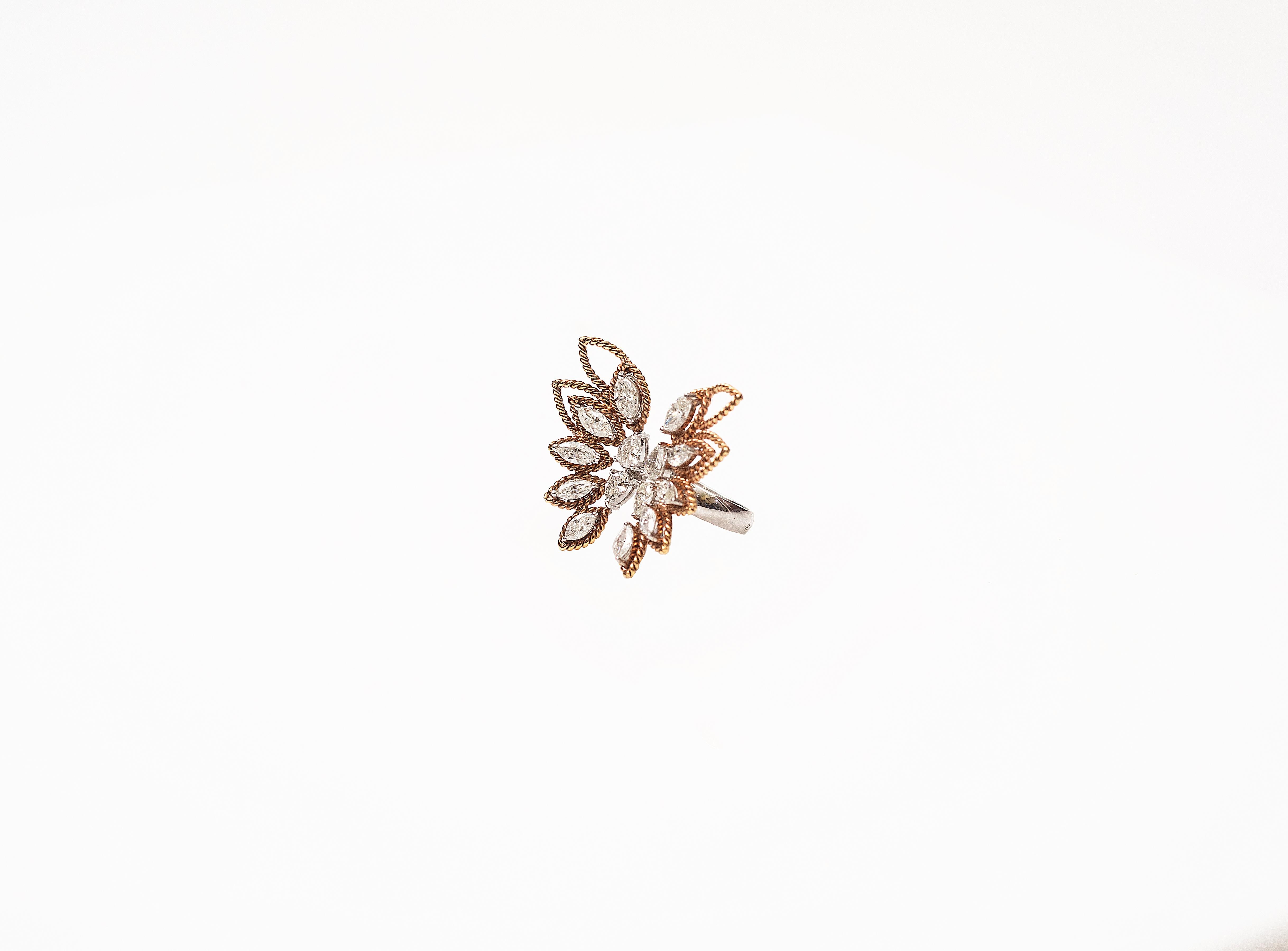 Handcrafted Butterfly Cocktail Ring in 18K Gold studded with Marquise shape Diamonds.
This ring consists of Twisted Gold Wire beautifully handmade in butterfly design. This ring is a statement making piece.
Gold weight - 12.052 gms
Diamond Clarity -