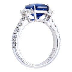 3.55 Carat Emerald Cut Sapphire Ring with Trapezoid Diamonds and Diamond Band