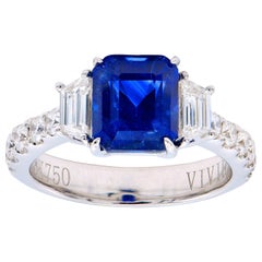 3.55 Carat Emerald Cut Sapphire Ring with Trapezoid Diamonds and Diamond Band