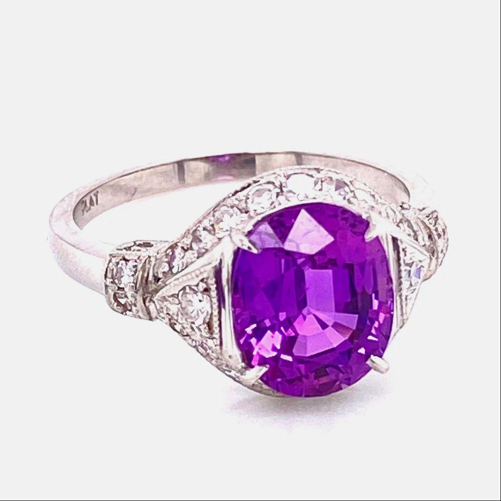 Simply Beautiful! Finely detailed Natural Purple GIA Sapphire and Diamond and Diamond Platinum Art Deco Cocktail Ring. Centering a securely nestled Hand set, Natural Purple GIA Sapphire weighing approx. 3.55 Carats. GIA lab report #1206642999.