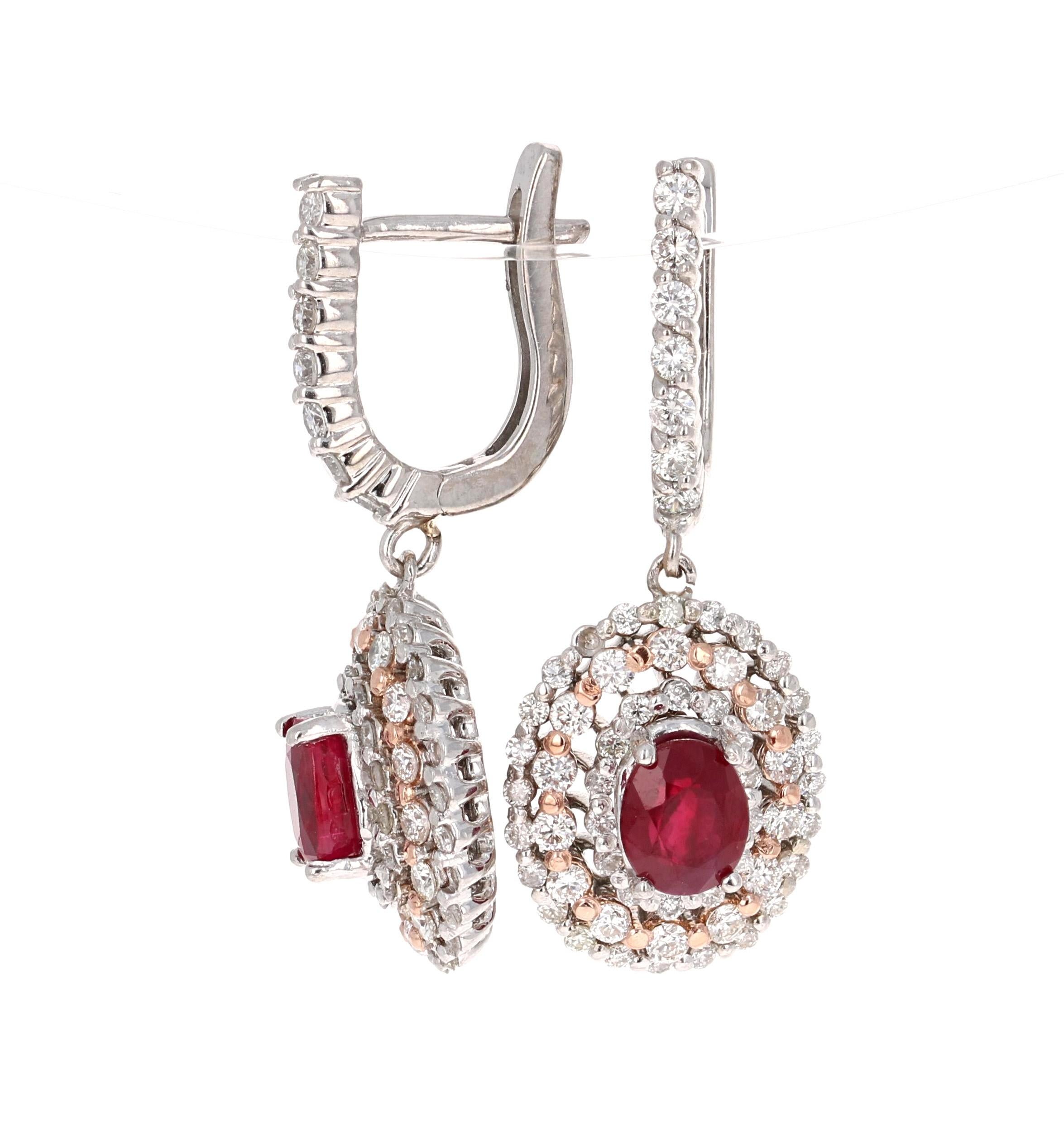 These earrings have 2 Natural Oval Cut Rubies that weigh 2.05 Carats. They are surrounded by 134 Round Cut Diamonds that weigh 1.50 Carats. (Clarity: VS2, Color: F).  The total carat weight of the Earrings is 3.55 Carats.

They are made in 14 Karat