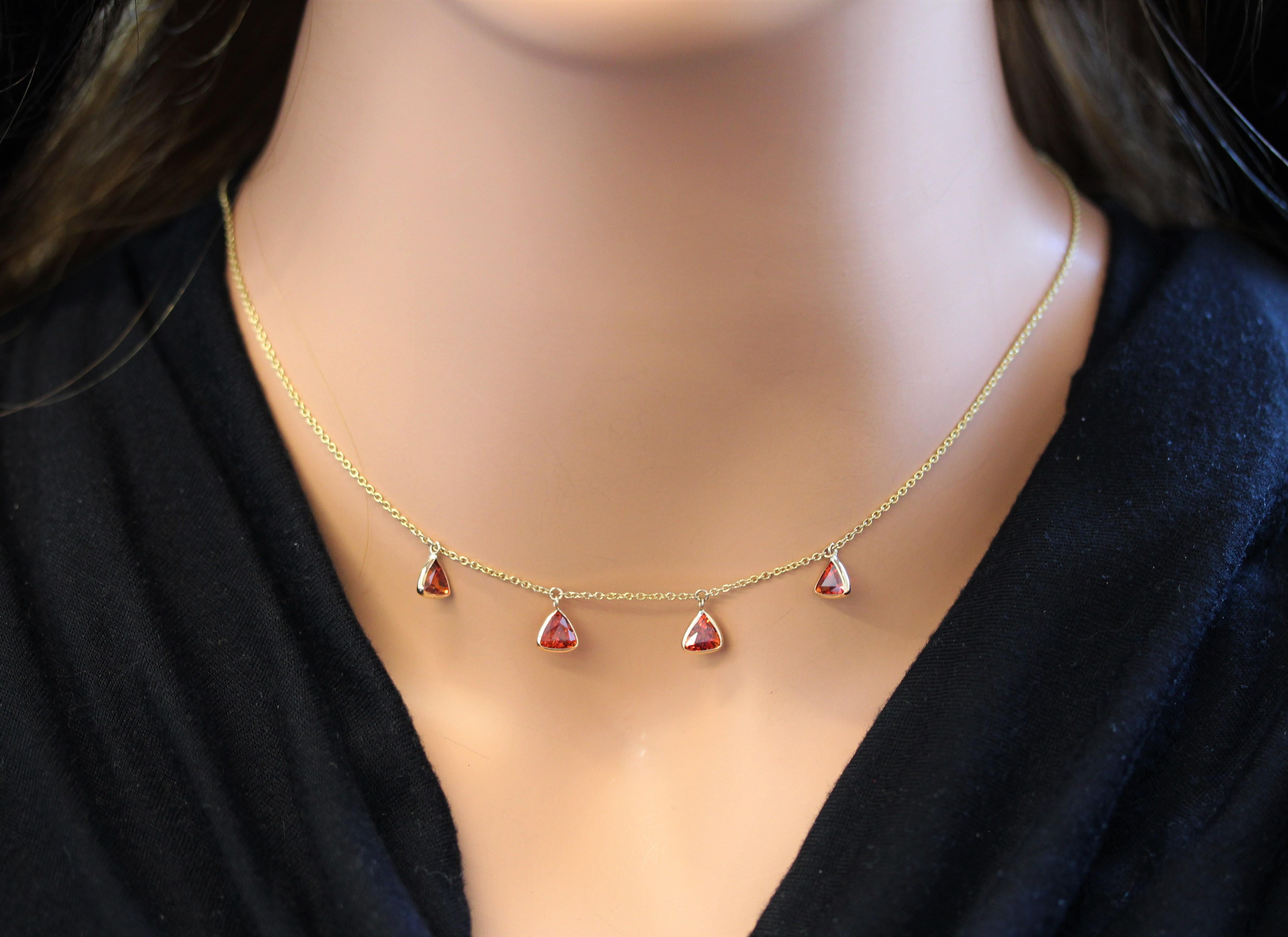 Make a statement worn solo and level up your collar candy when layered. How would you wear it? This is a natural Trilliant , Gemstone Spessartite, Orangy Red, handmade necklace wire-wrapped in 14k yellow gold. This is a piece you'll wear forever. We