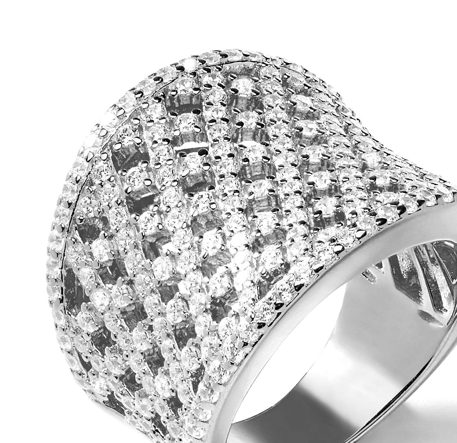 This bold, intricately designed lattice cut band ring is guaranteed to attract admiring glances. 

3.50ct round brilliant cut cubic zirconia embellish this beautiful and unusual concave design statement piece. 

Composed of 925 sterling silver with
