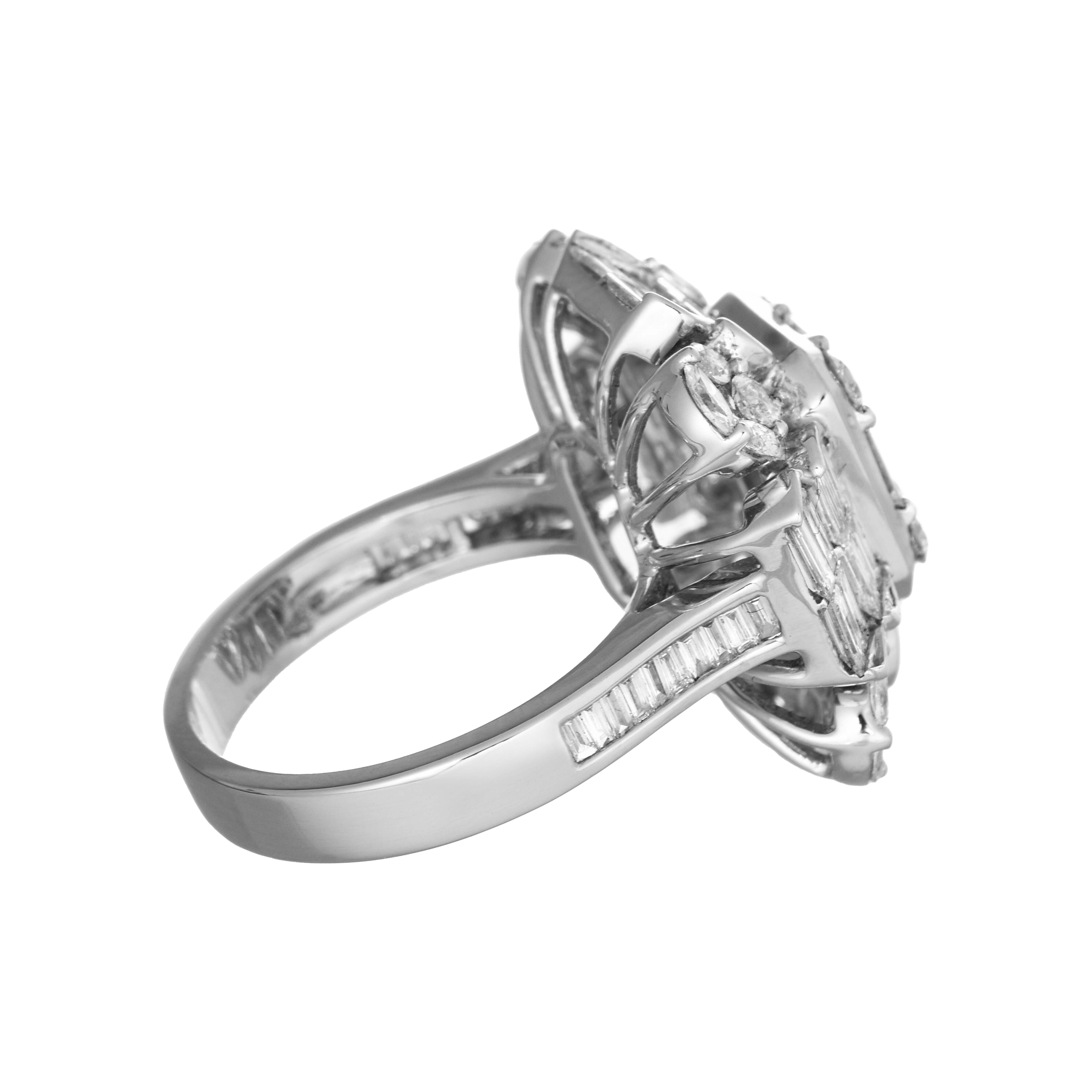 This elegant ring features a sophisticated arrangement of variously cut diamonds, set in a white gold band embellished with baguette diamonds. The blend of cuts and the high-quality setting make this piece an exquisite statement of luxury and