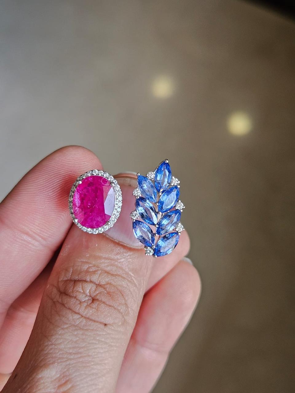 A very gorgeous and beautiful, modern style, Ruby & Blue Sapphire Engagement / Cocktail Ring set in 18K  White Gold & natural Diamonds. The weight of the Oval Ruby is 3.55 carats. The Ruby is completely natural, without any treatment and is of
