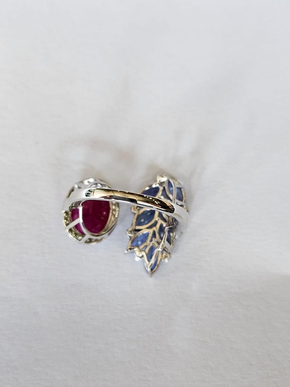 Modern 3.55 carats, natural Mozambique Ruby, Blue Sapphires & Diamonds Engagement Ring For Sale