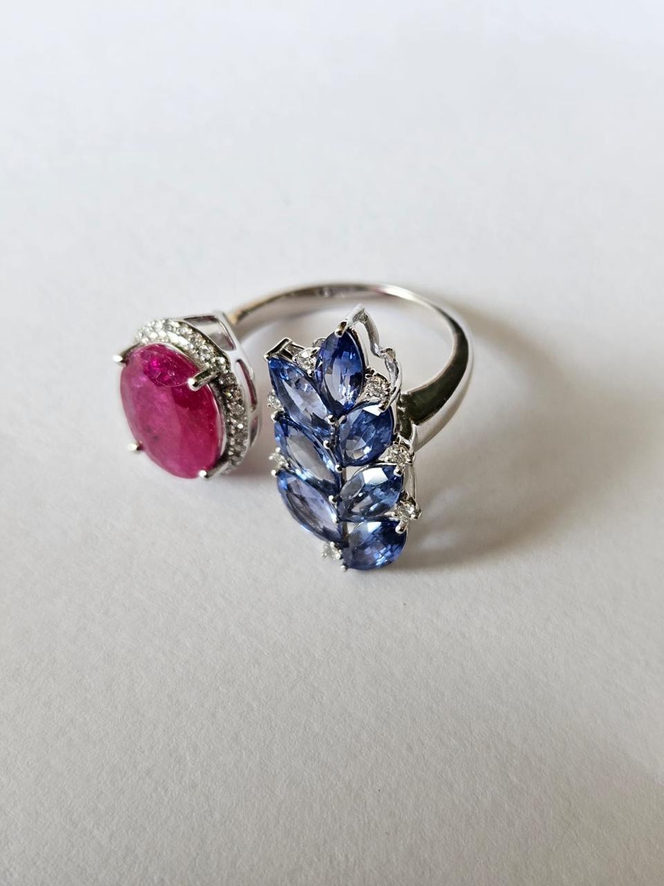Oval Cut 3.55 carats, natural Mozambique Ruby, Blue Sapphires & Diamonds Engagement Ring For Sale