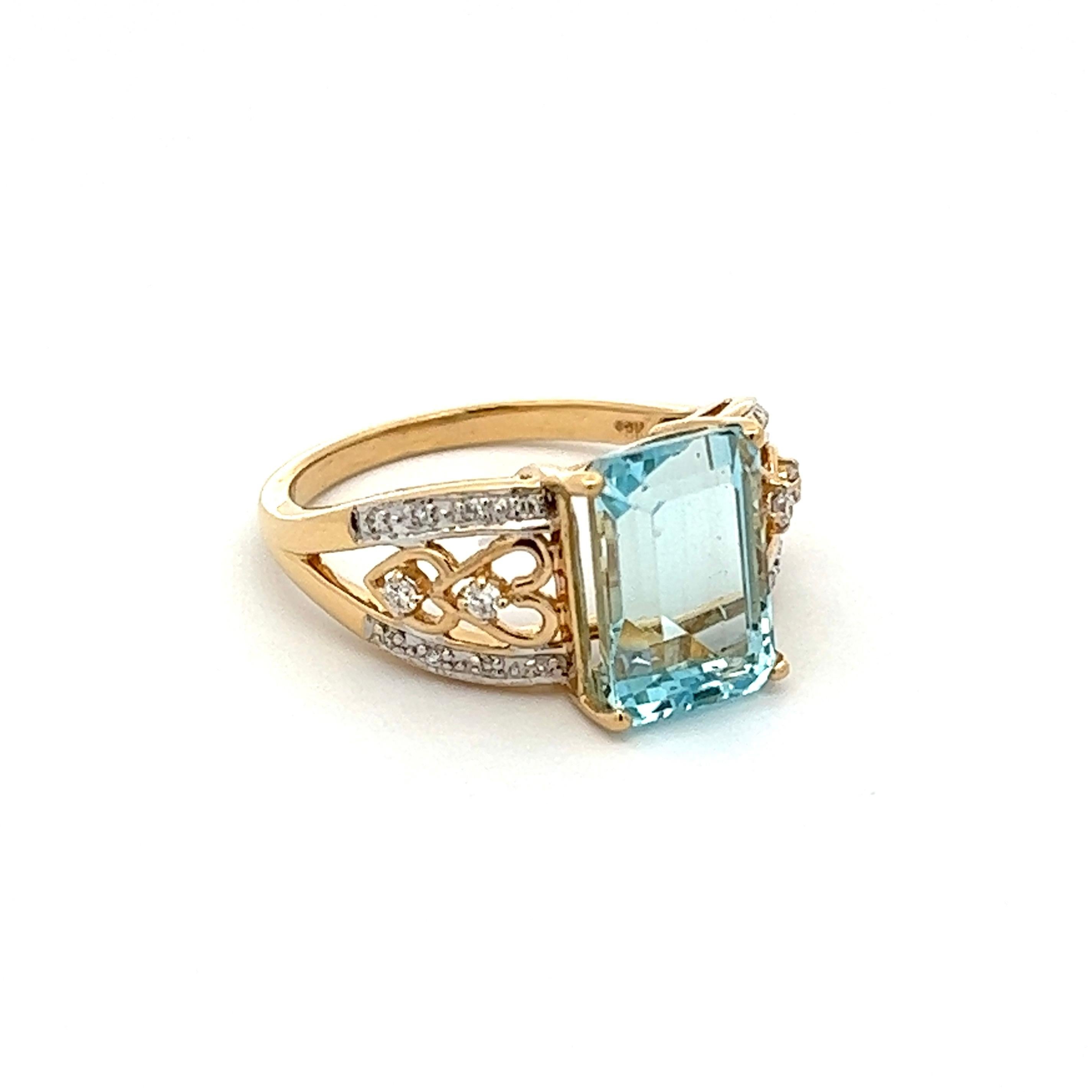 Simply Beautiful! Finely detailed Aquamarine and Diamond Art Deco Revival Cocktail Ring. Centering a Hand set securely nestled 3.55 Carat Emerald-cut Aquamarine, accented on either side by Round Brilliant-Cut Diamonds, weighing approx. 0.18tcw