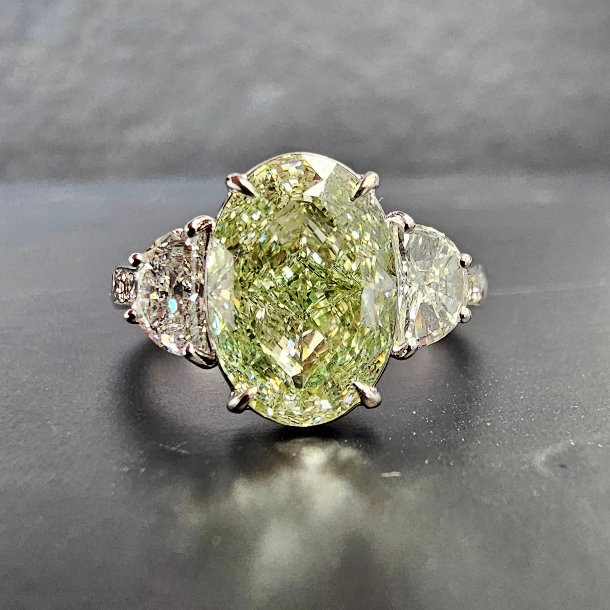 Our new line of diamonds with flavors of green in them set in a ring with green painted enamel under the diamond to make it appear as a pure green diamond. The diamond is 100% natural and GIA certified, but the ring is colored underneath the stone