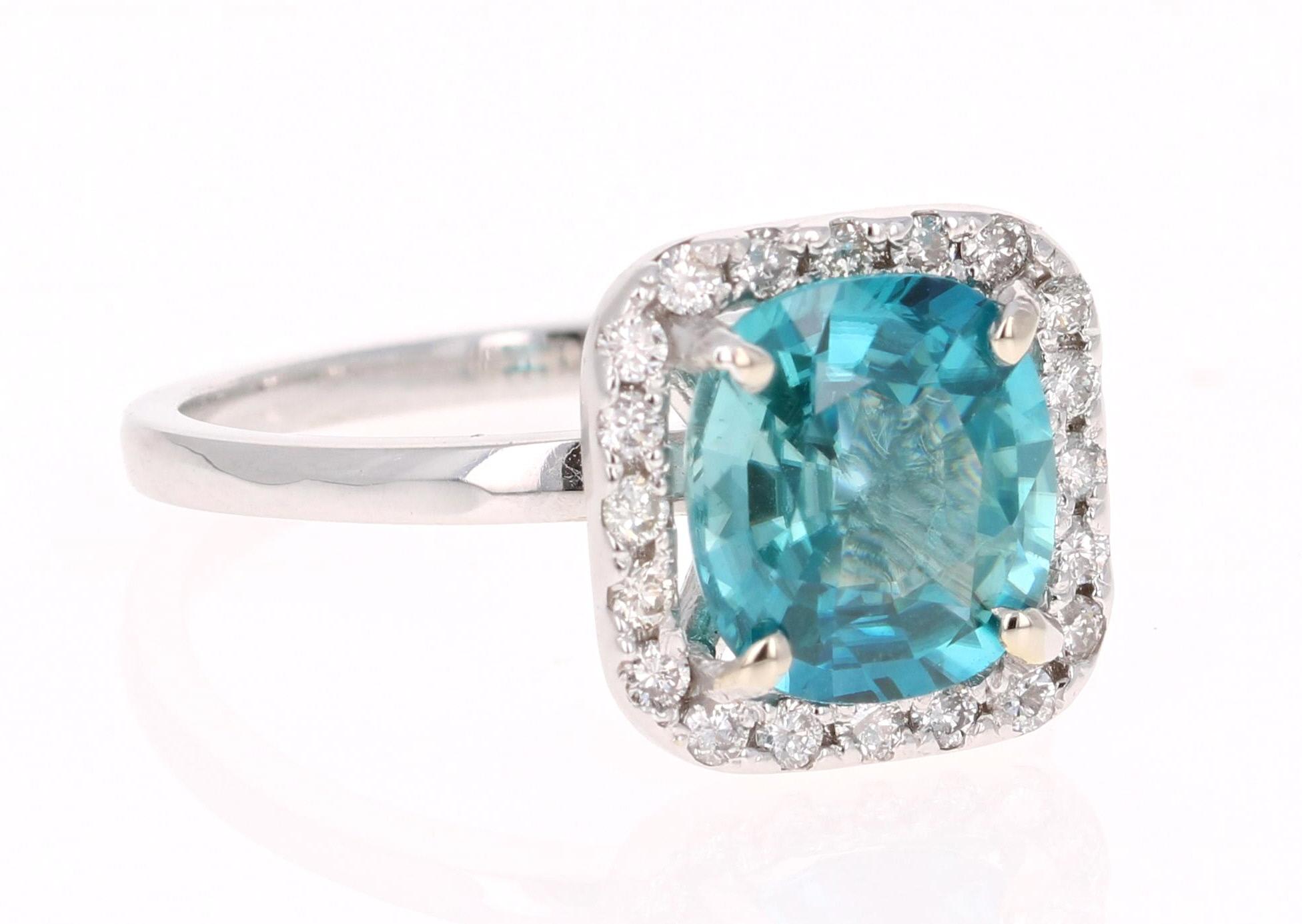 A beautiful Blue Zircon and Diamond ring that can be a nice Engagement ring or just an everyday ring!
Blue Zircon is a natural stone mined mainly in Sri Lanka, Myanmar, and Australia.  
This ring has a Cushion Cut Blue Zircon that weighs 3.29 carats