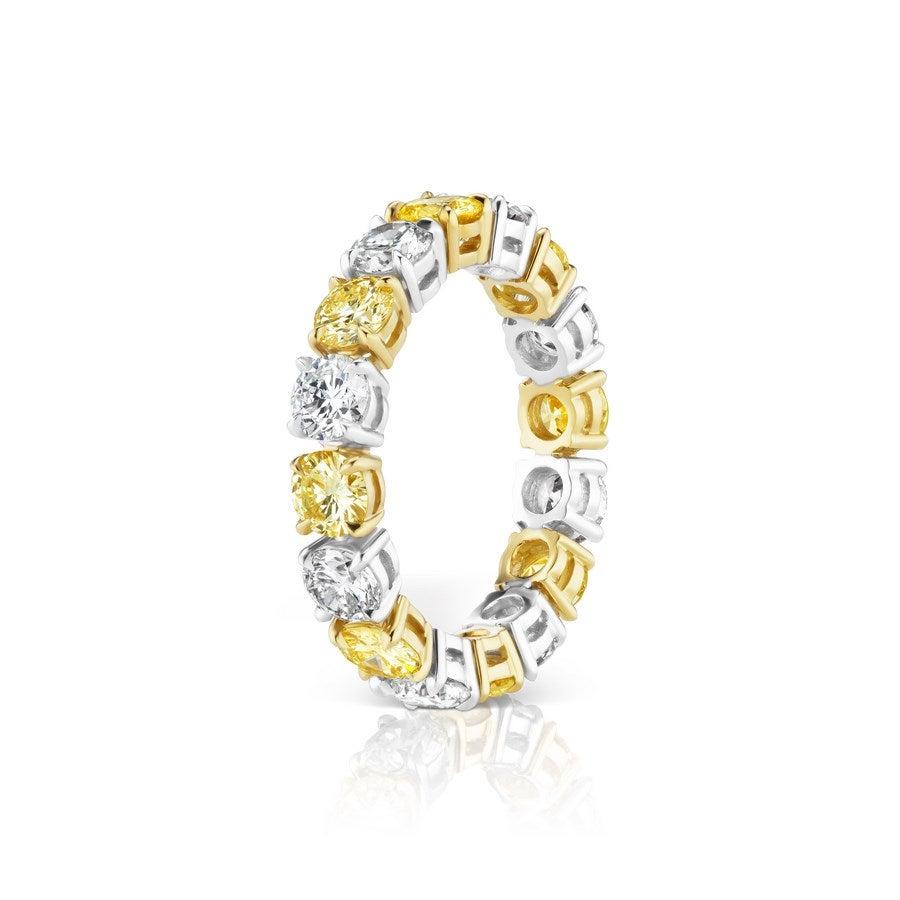 This beautiful and understated Ring features both White and Yellow Diamonds.
8 Yellow Diamonds weigh 1.76 Carats.
8 White Diamonds weigh 1.80 Carats.
Set in Platinum and 18 Karat Yellow Gold.
Finger Size 6.5.
Pictured as stackable too.