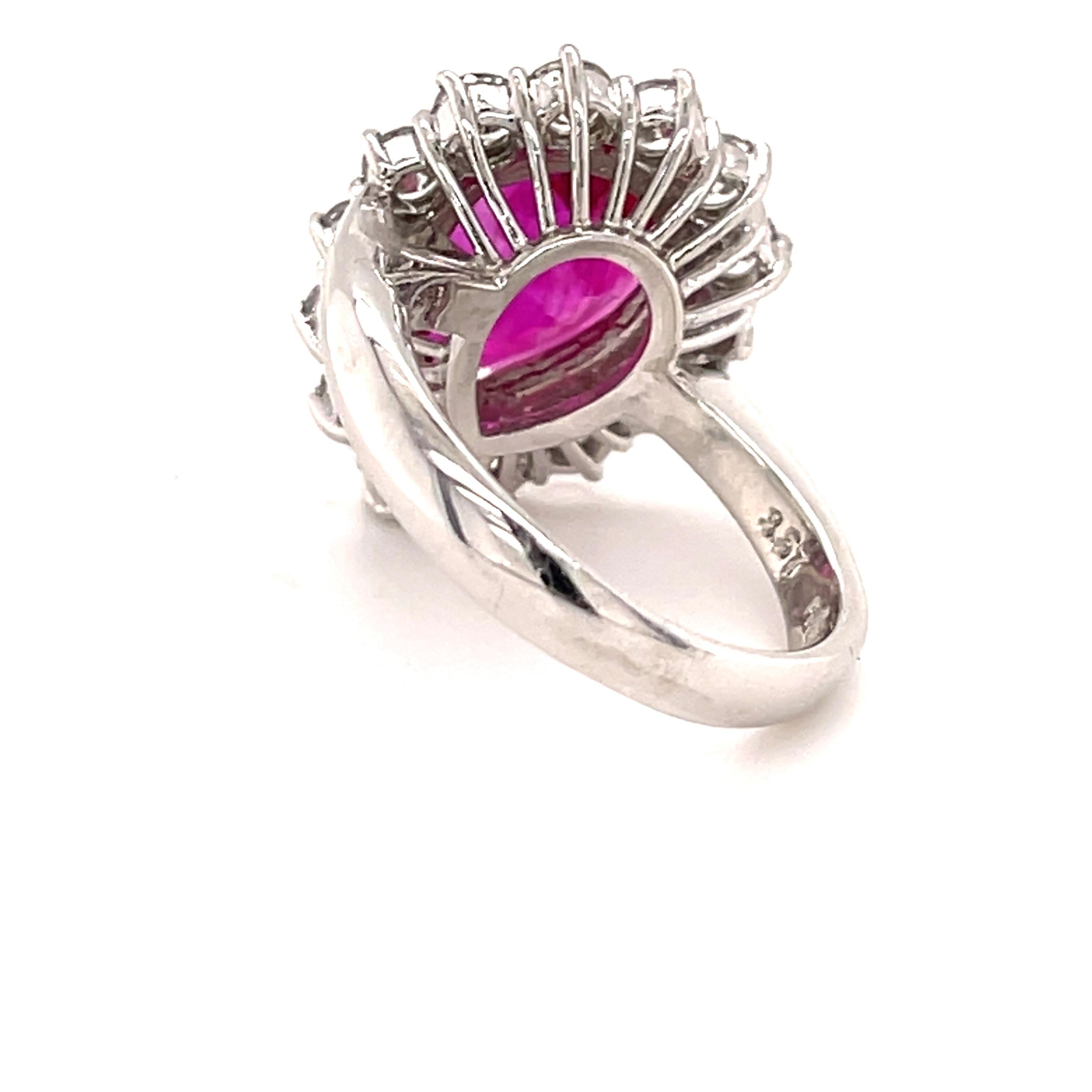 This classic cocktail ring has a 3.57 carats purplish-red pear shape natural Ruby as a center-stone, with measurements of 11.67 x 9.61 x 4.47 and a report from the Gemological Insitute of America (GIA) Number 2183800291 showing that the stone has an