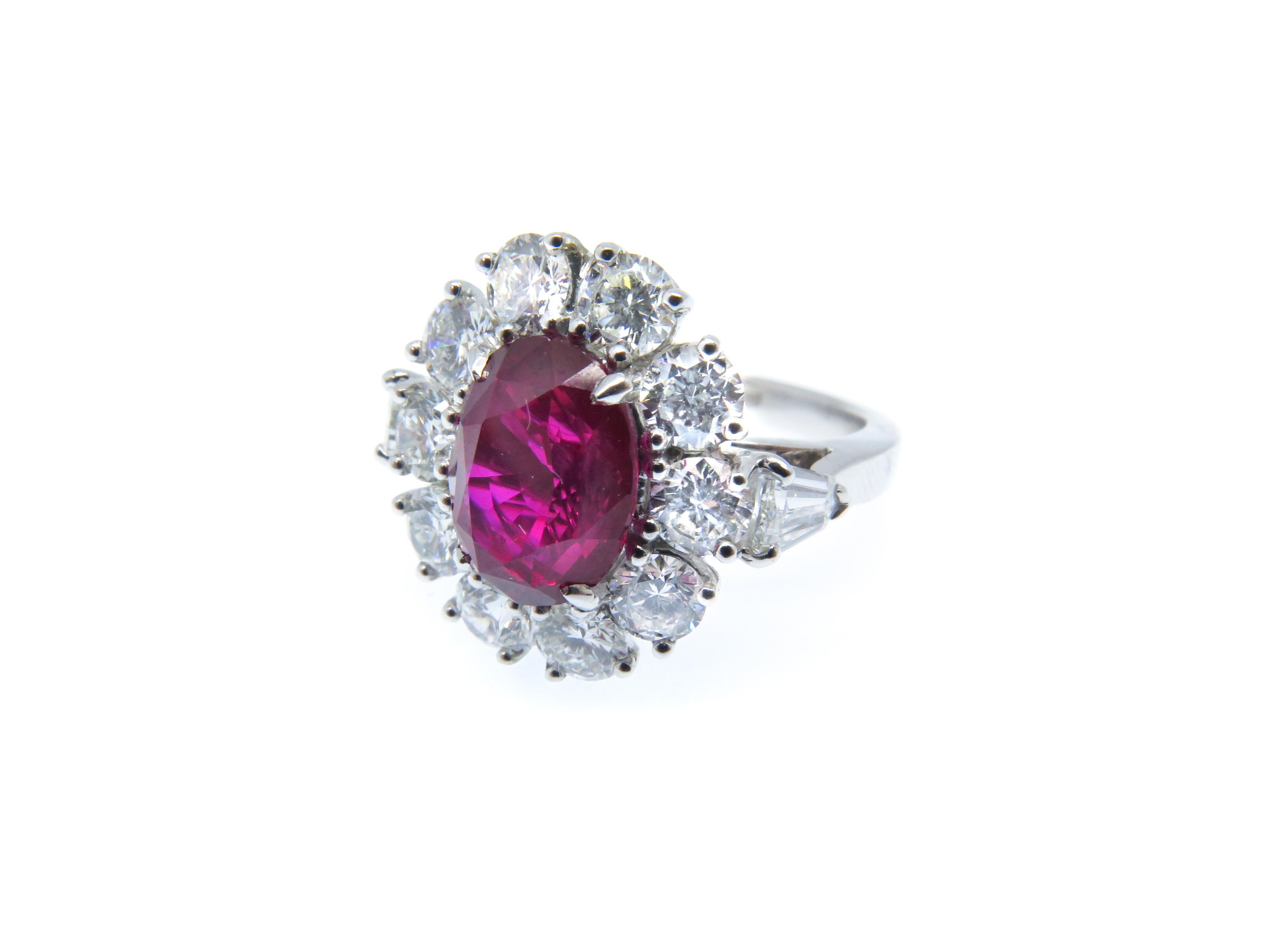 Platinum 3.57 Carat Oval Mozambique Ruby and White Diamond Cluster Ring In New Condition For Sale In London, GB