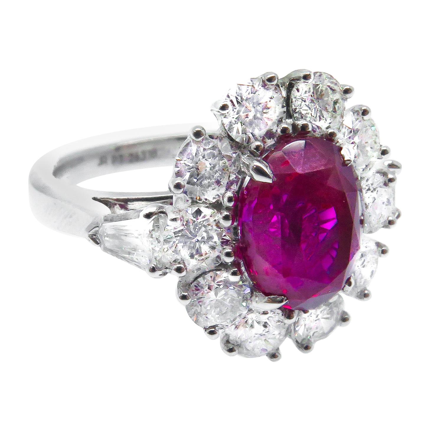 Platinum 3.57 Carat Oval Mozambique Ruby and White Diamond Cluster Ring For Sale
