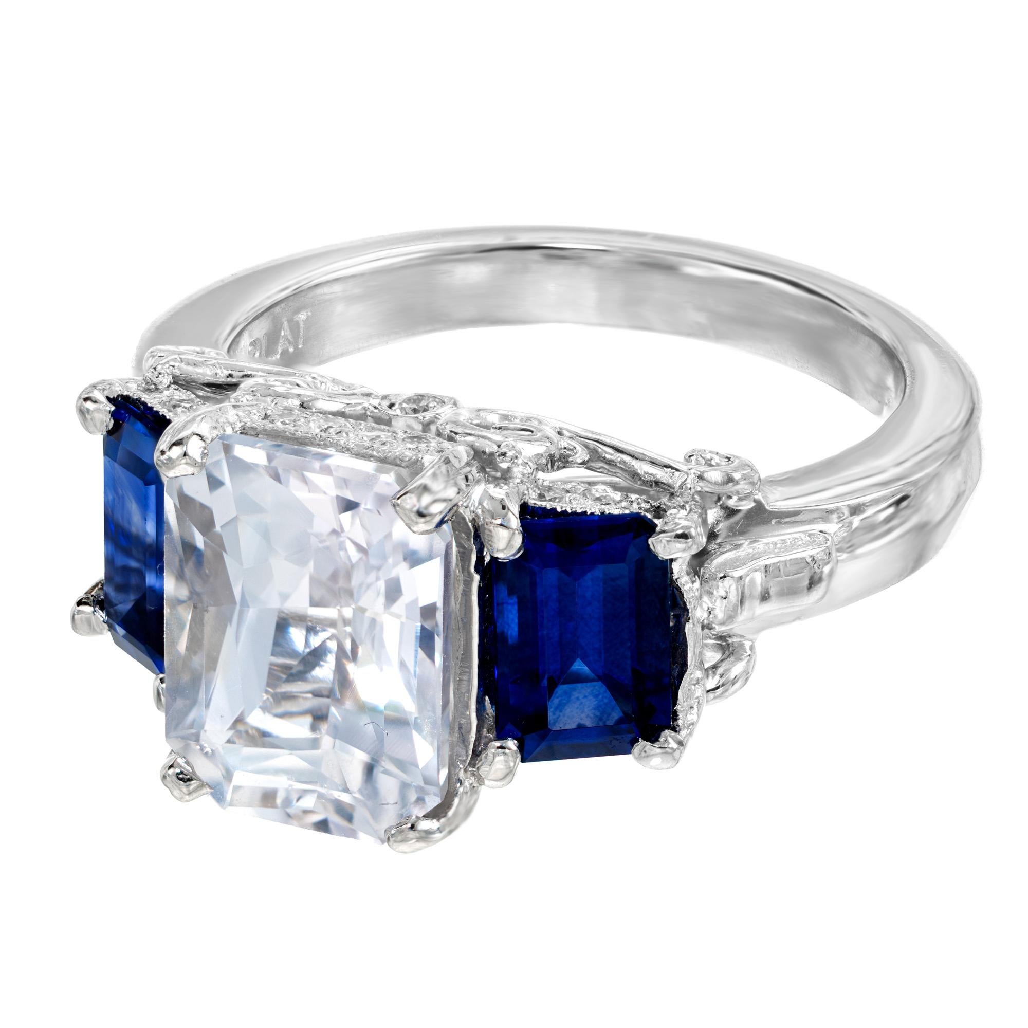 Three stone sapphire diamond engagement ring. This beautiful setting came to us with gemstones we did not feel showcased the beauty of the setting. The 1920's center stone was replaced with a unique light pink 3.57ct octagonal sapphire with a raised