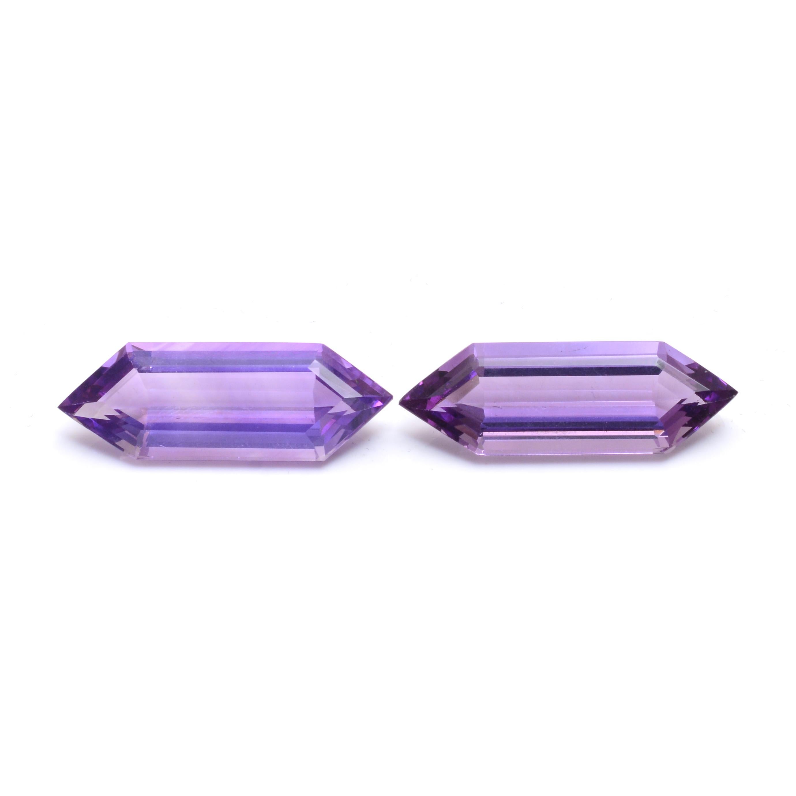 35.75 Carat Natural Fancy-Cut Pair of Amethysts:

A beautiful gem, this listing features a pair of natural fancy-cut amethysts weighing 35.75 carat. The amethysts possess an intense reddish violet colour, with superb clarity and brilliance. The