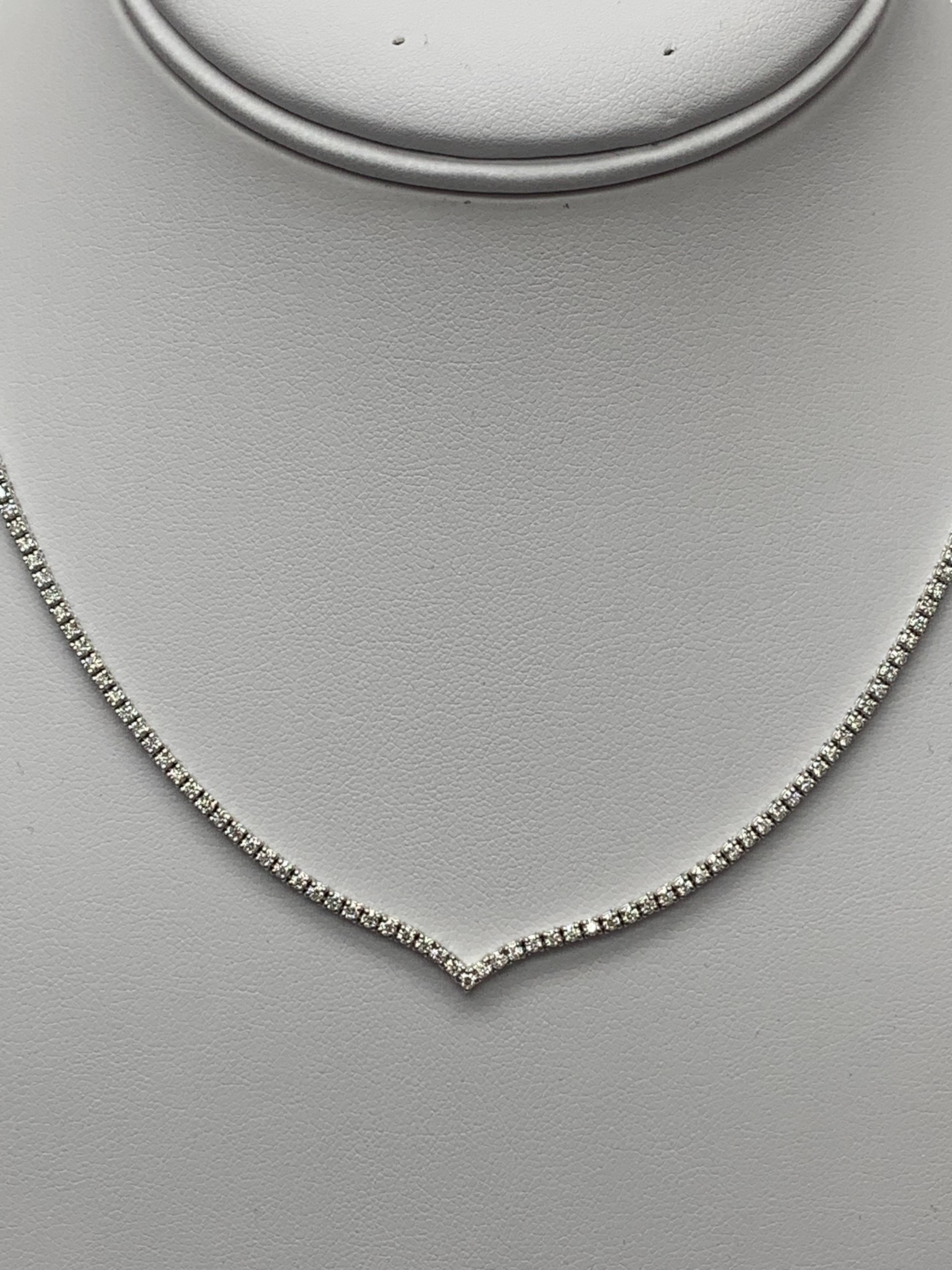 A brilliant and classic tennis necklace showcasing a line of round diamonds in 14K White Gold. The 209 diamonds in this necklace are brilliant round cut and weigh 3.58 carats in total. 16 inches in length.