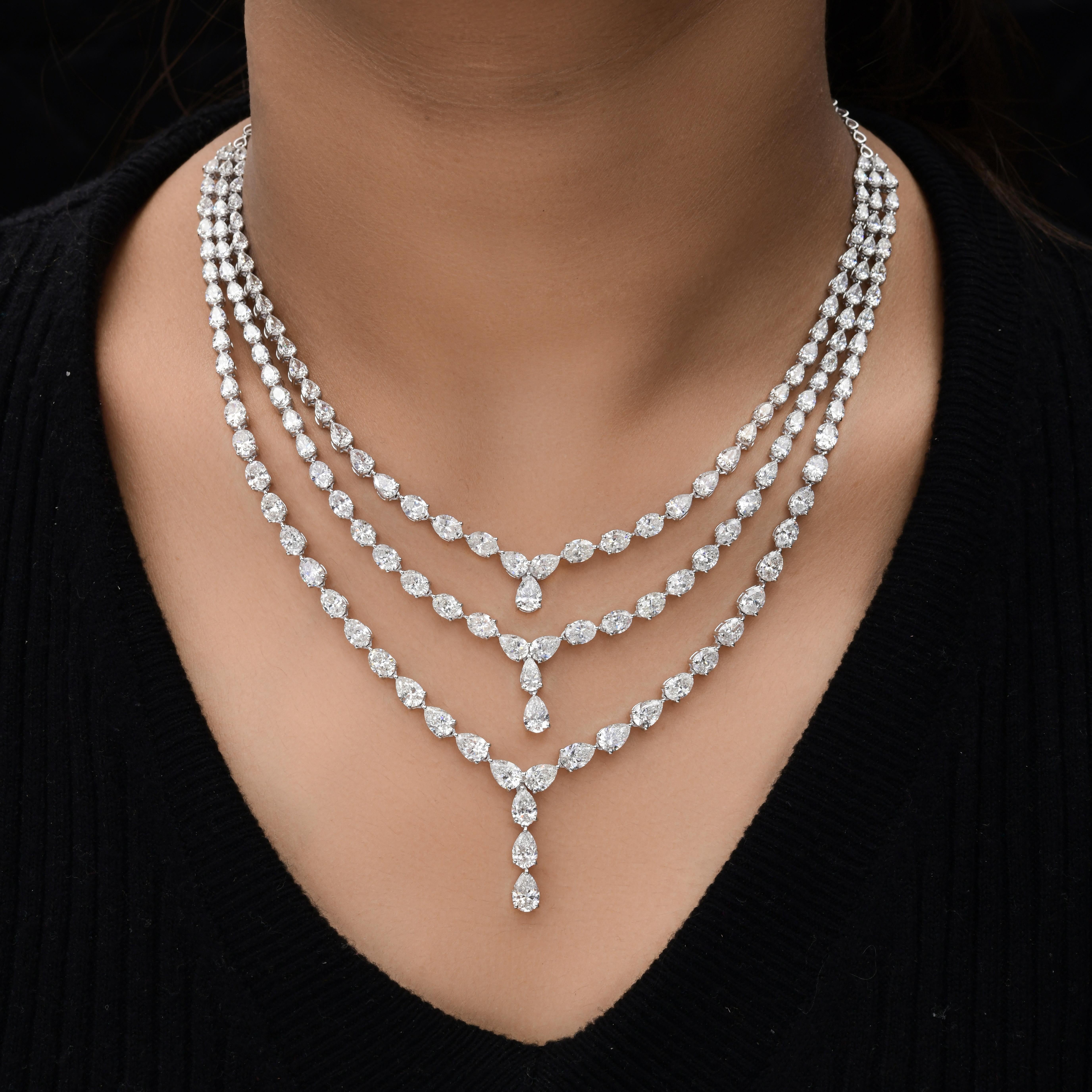 35.80Ct Triple Layer Pear & Round Cut Bridal Diamond Necklace 14K Solid Gold.
This necklace features a graduated triple-layer design, where each strand is meticulously aligned to achieve a harmonious flow of light and symmetry. The centerpiece