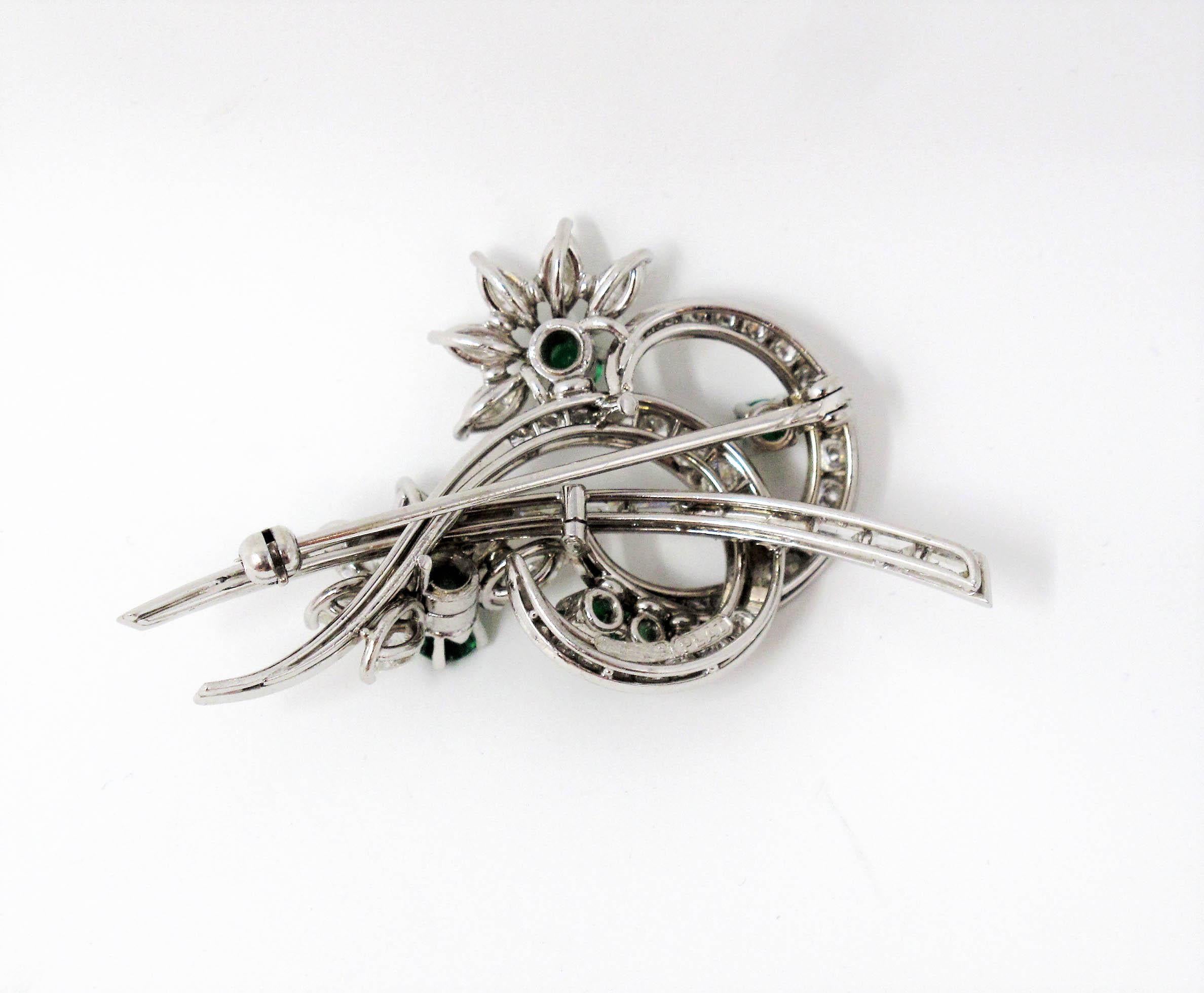 Women's Emerald and Multi Shape Diamond Swirling Design with Flowers Platinum Brooch For Sale