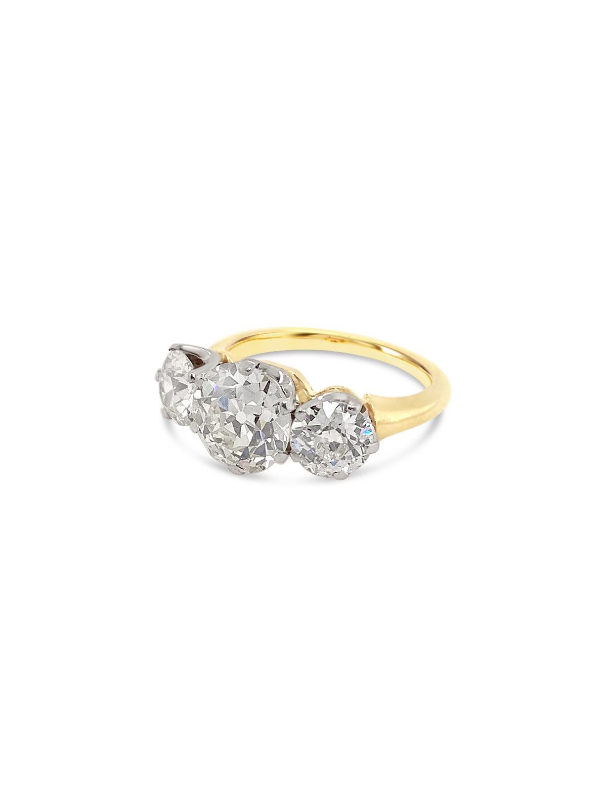 3.59 Carat total weight three-stone Old European cut diamond ring.  Center diamond is 2.15 carats in J VS2 quality, sides are 0.72 each or 1.44 carat total weight in I SI2 quality. 18 karat yellow gold and platinum. Currently finger size 6.5 with