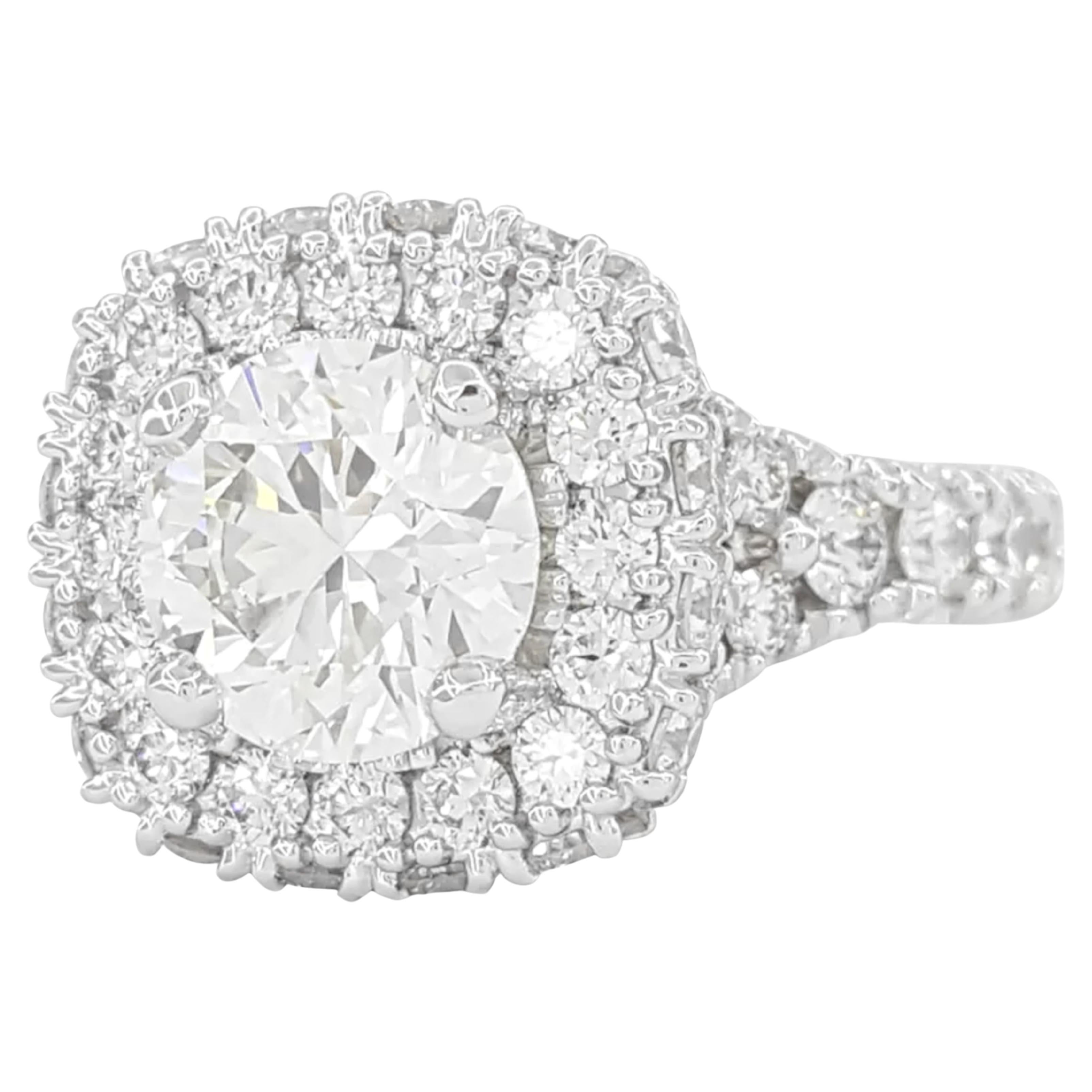 3.59 ct Total  Acclaim Round Ideal Cut Diamond Engagement Ring is a stunning piece crafted in platinum, weighing 14 grams and sized at 7.5. The centerpiece is a 2 ct natural round ideal triple excellent cut diamond, which is known for its