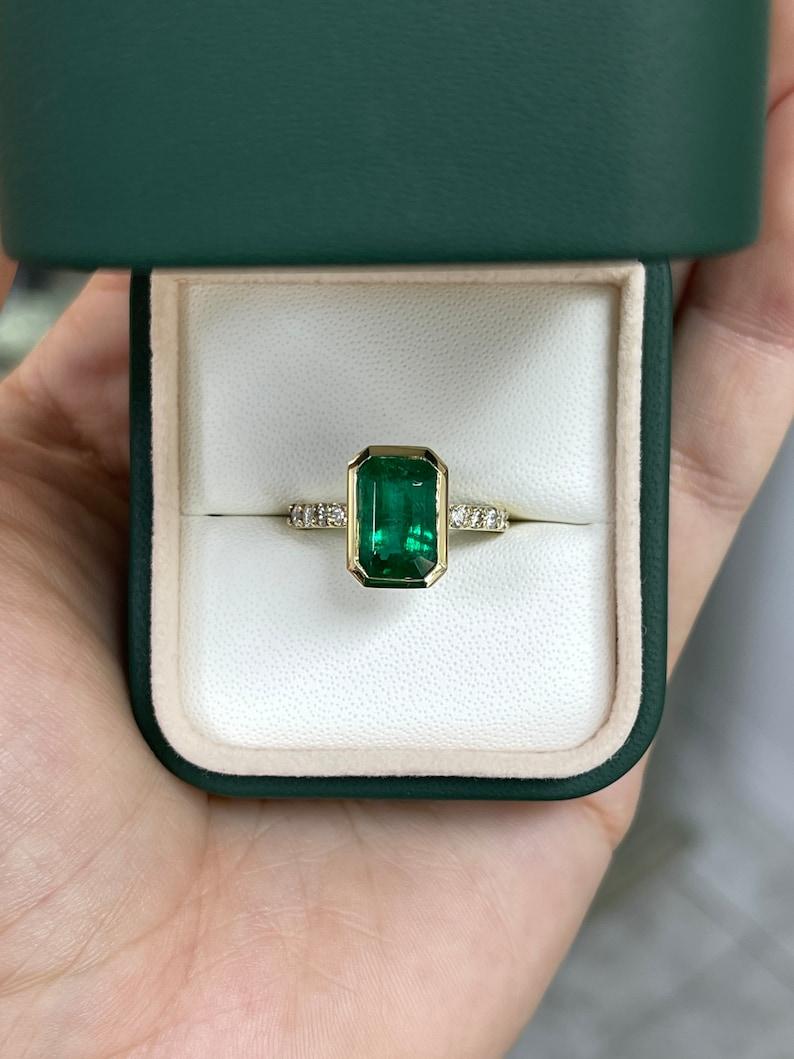 Modern 3.59tcw 14K Emerald Cut Emerald & Diamond Ring - Deep Green Bezel Set Design For Sale