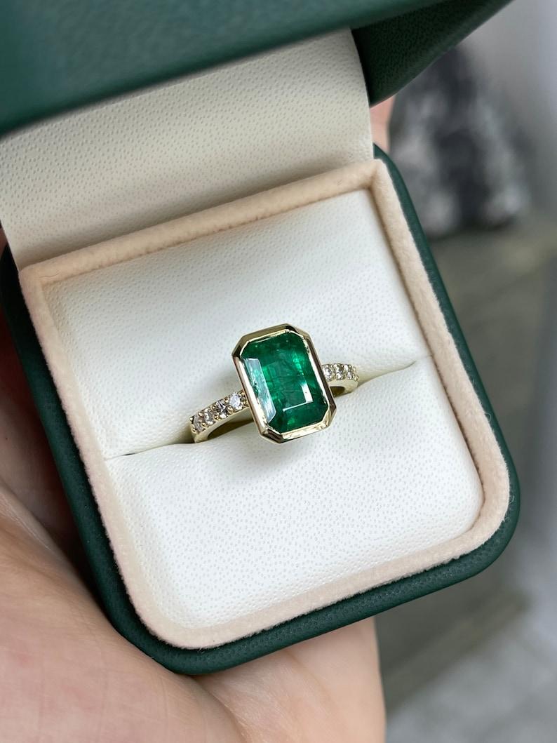 3.59tcw 14K Emerald Cut Emerald & Diamond Ring - Deep Green Bezel Set Design In New Condition For Sale In Jupiter, FL