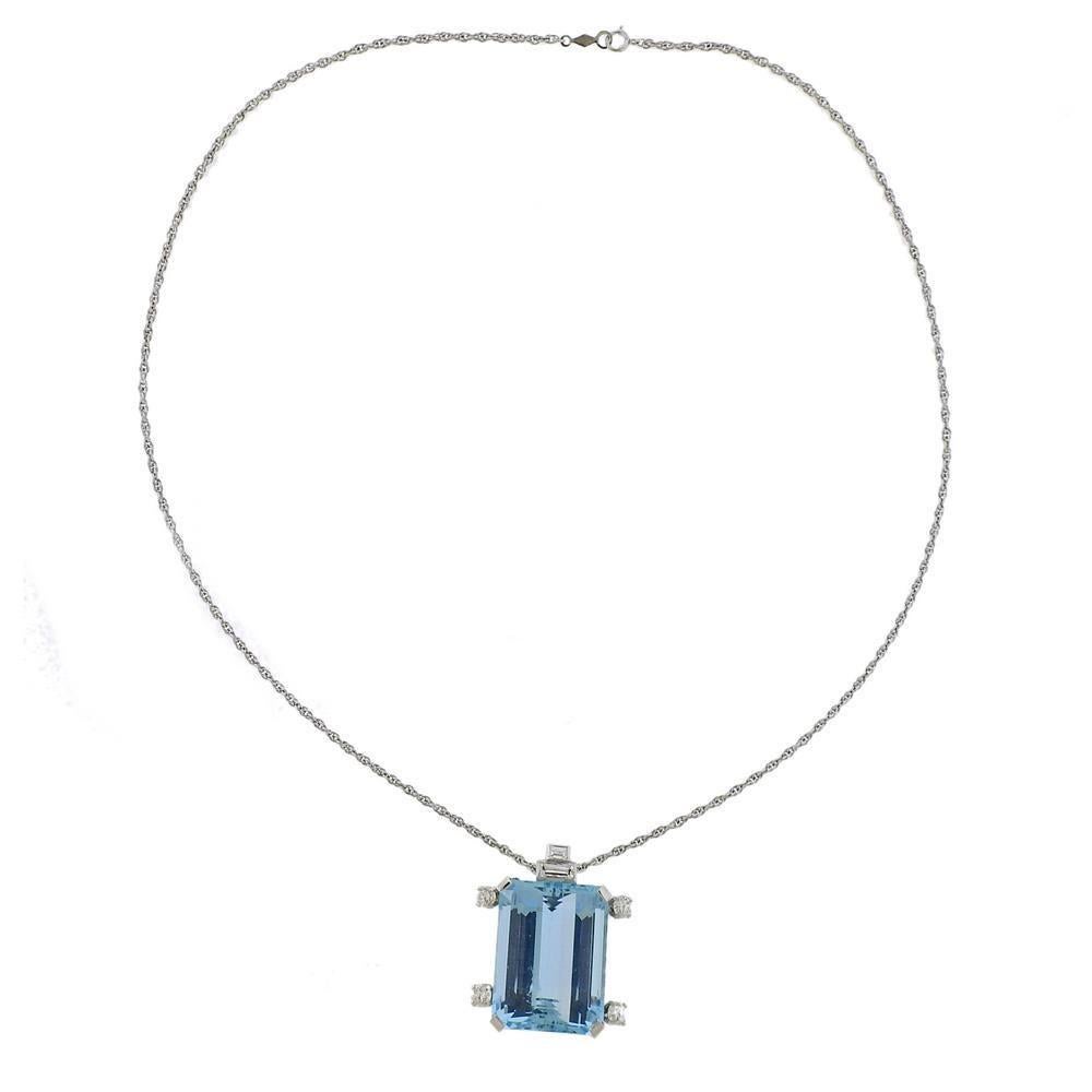 14k gold chain with suspended 14k gold pendant, featuring approx. 35ct aquamarine (stone measures approx. 22.8 x 18.2 x 12.03mm), surrounded with approx. 0.90ctw in diamonds. Marked on chain 14k. Weigh  - 16.8  grams.