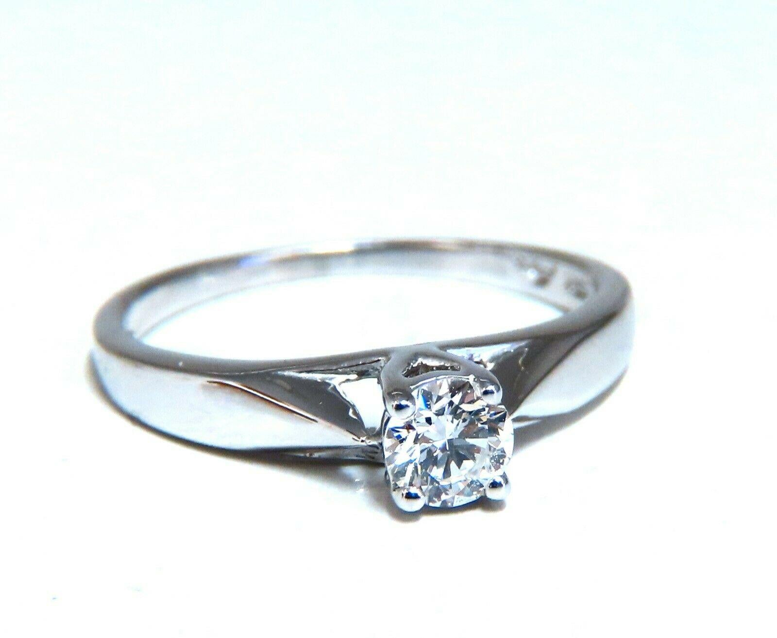 Traditional Engagement ring.

.35ct. round natural diamond

3.8mm diameter. 

G-color Vs2 clarity.

14kt white gold 

2.1 grams.

current ring size: 4.75

We may resize, please inquire.