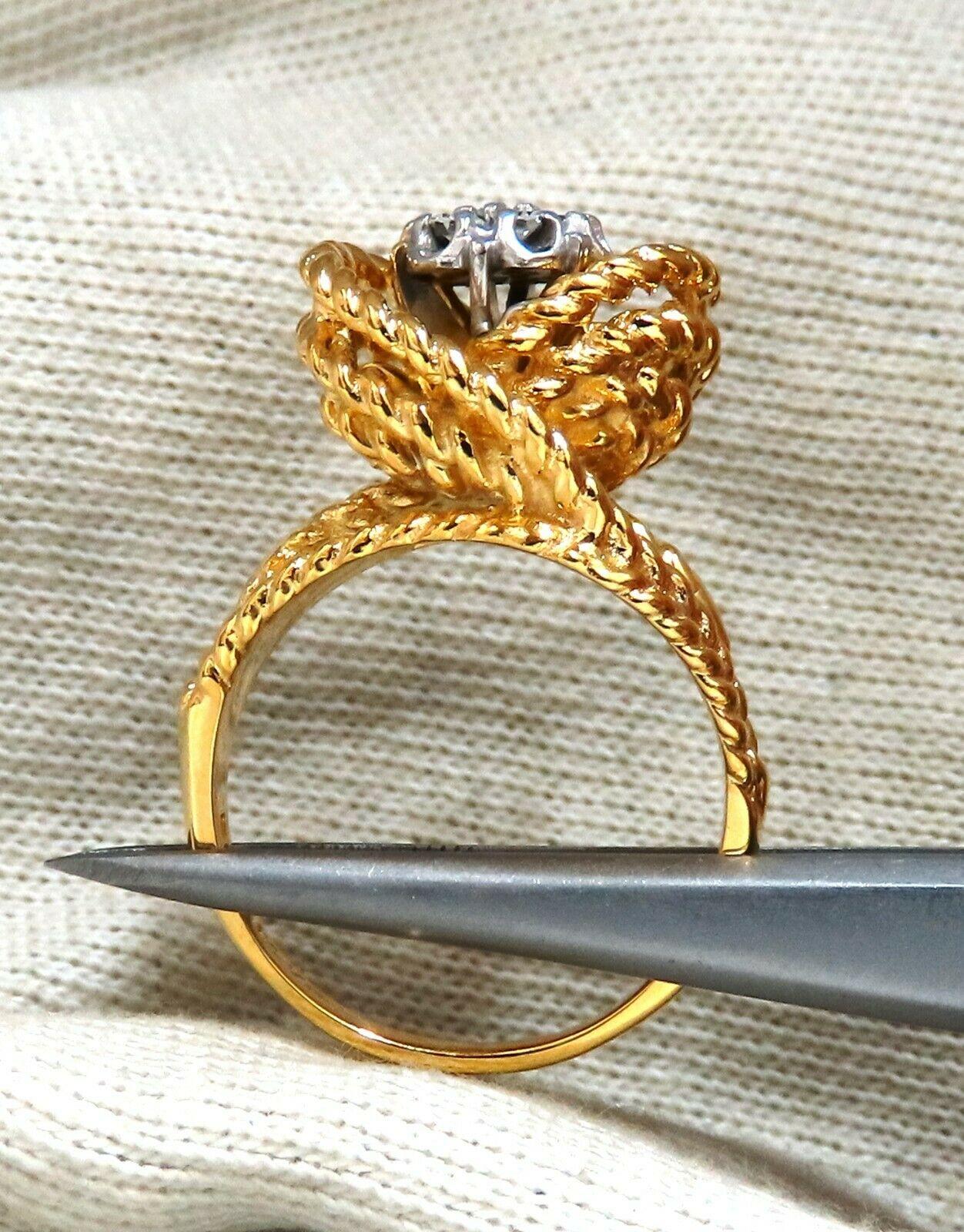 Rope Twist Cluster

.35ct Natural Round Cut Diamonds. 

Vs-2 clarity H color.

14kt yellow gold

8.3 Grams

Overall ring: 16.3mm 

Depth: 12mm

Current ring size: 7.5

May professionally resize, please inquire.
