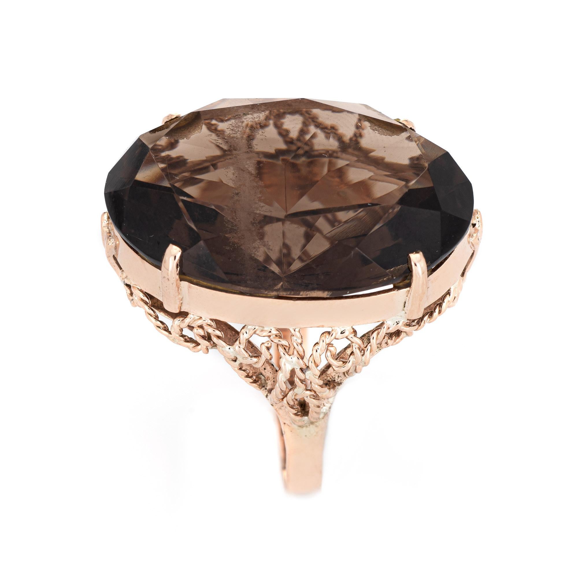 Stylish vintage estimated 35ct smoky quartz cocktail ring (circa 1950s to 1960s) crafted in 14 karat rose gold. 

Oval faceted smoky quartz measures 27mm x 20mm (estimated at 35 carats). The quartz is in excellent condition and free of cracks or
