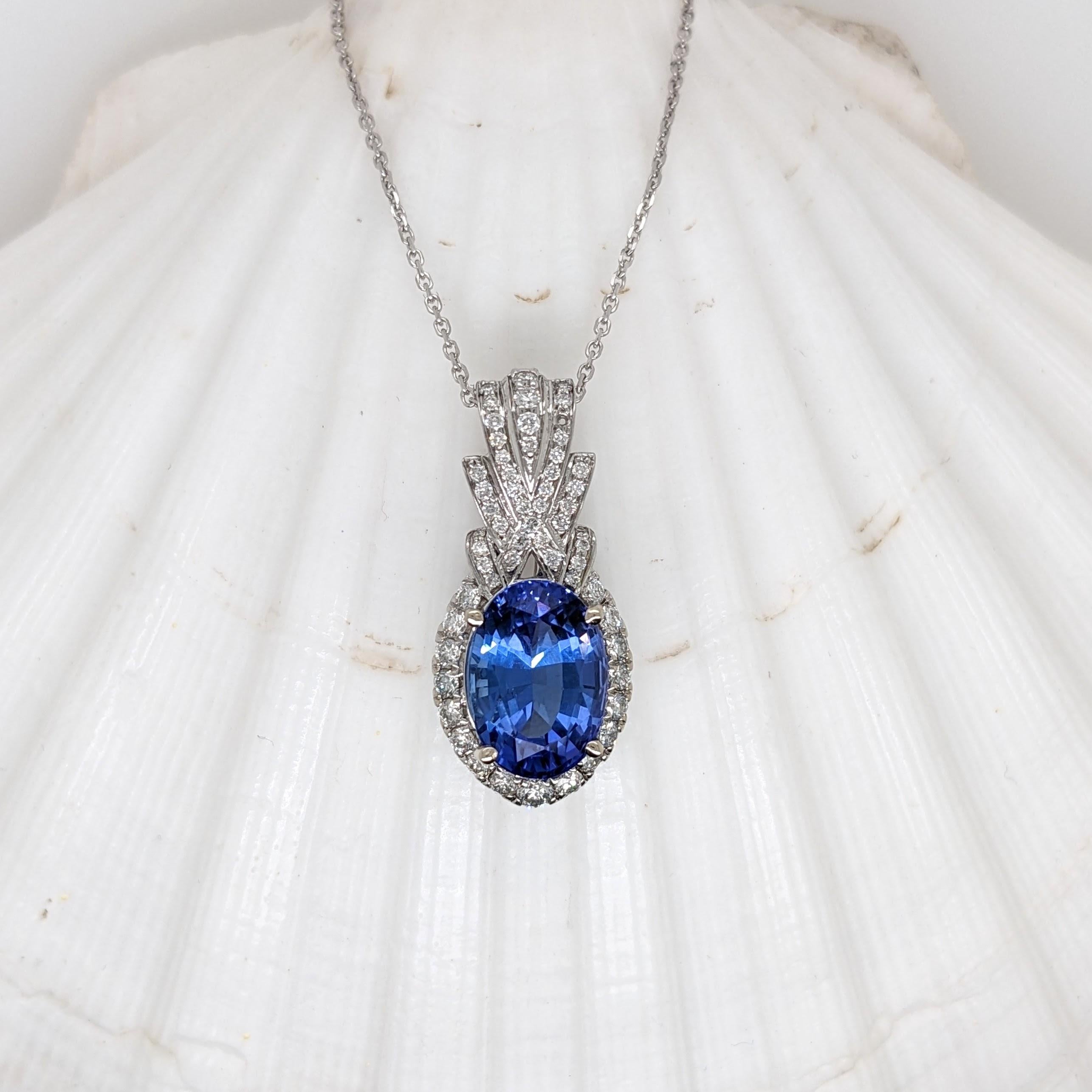 This hand picked tanzanite is absolutely gorgeous with a rich blue color and beautiful clean oval cut. We set it in a new NNJ pendant design (that reminds us a little of a pineapple!) made in 14k solid white gold and studded with all natural