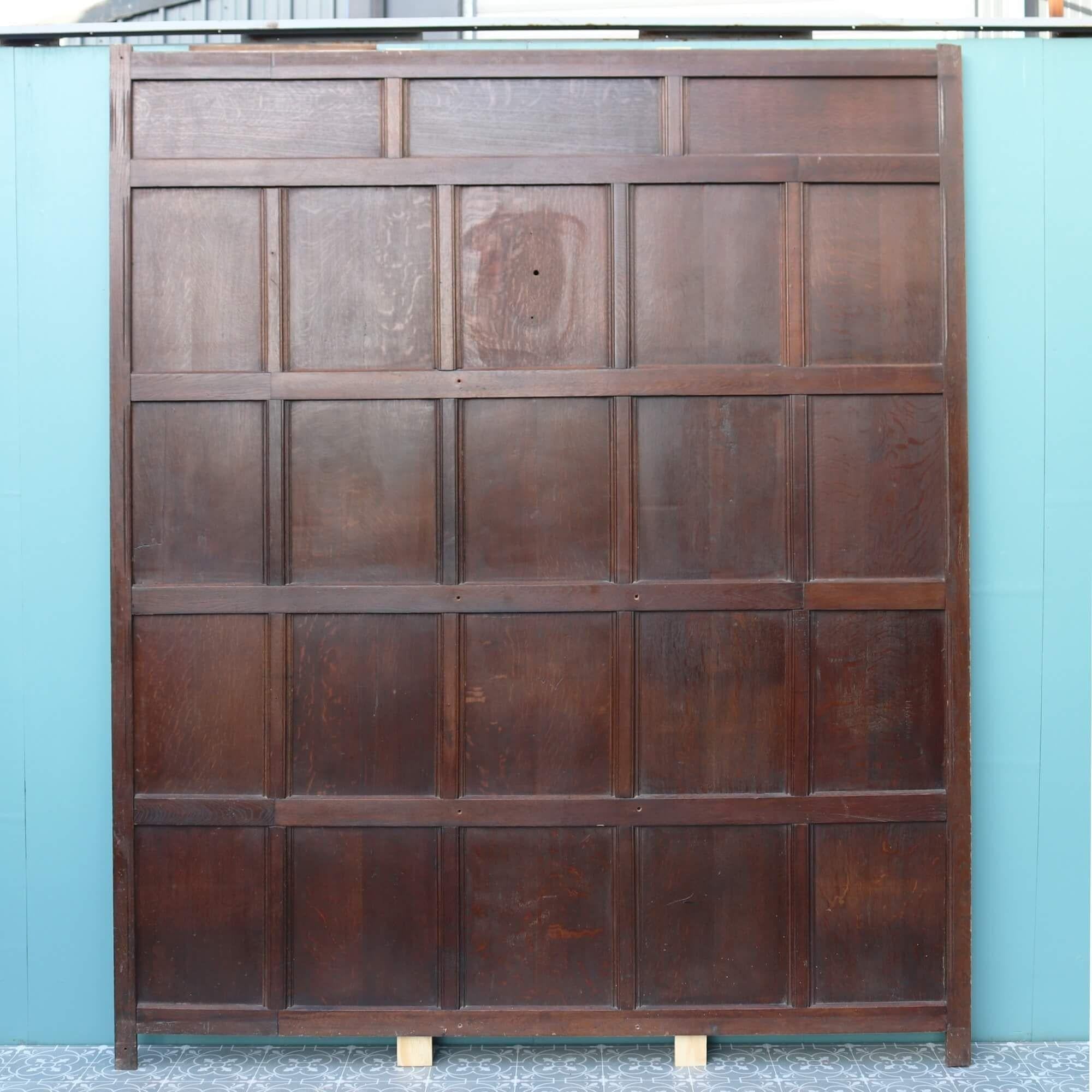 A long run of early 20th century reclaimed oak panelling plus a few spare parts with a dark oak finish.

This set of antique wall panelling comprises of 8 tall panels of varying widths (see below for detailed dimensions) plus a few spare parts for